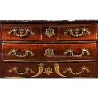 A Régence Gilt Bronze Mounted Marquetry Marble-Top Commode