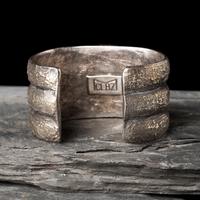 Mitchell Calabaza (Kewa, b. 1959) — Tufa Cast Silver and Turquoise Cuff Bracelet