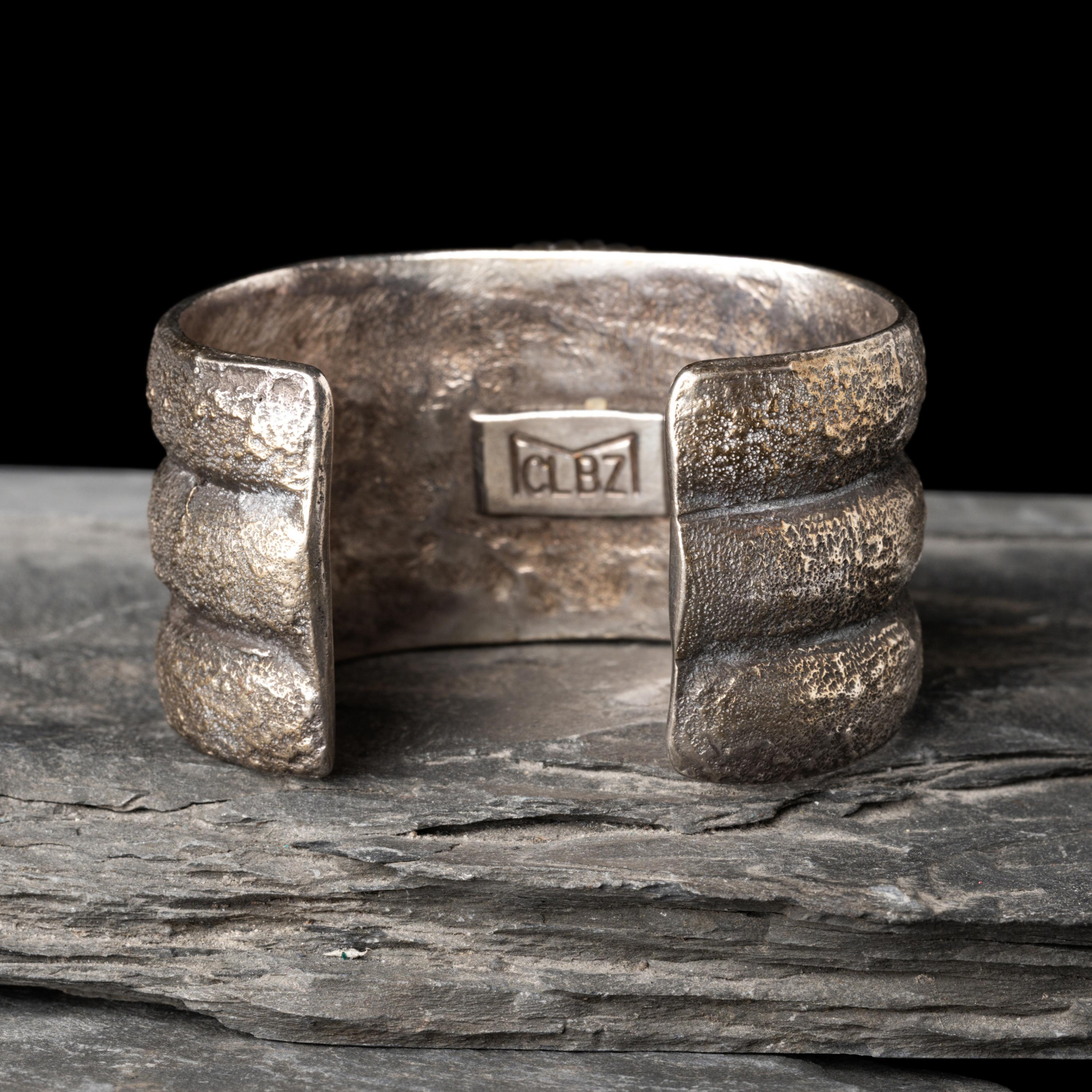 Mitchell Calabaza (Kewa, b. 1959) — Tufa Cast Silver and Turquoise Cuff Bracelet