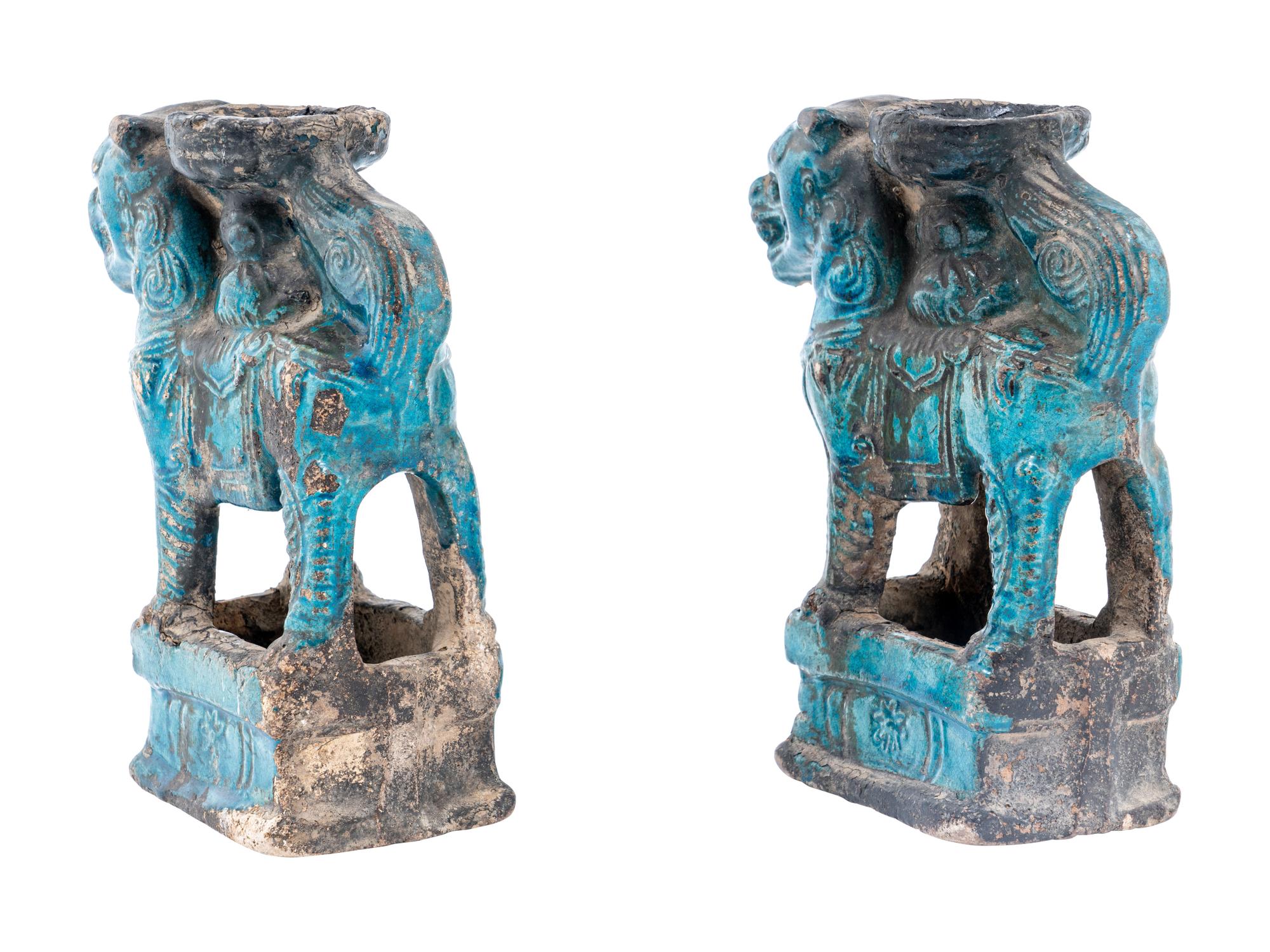A Pair of Chinese Turquoise Glazed Pottery Fu Lion-Form Candle Holders