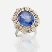 A sapphire, diamond, gold, and platinum ring