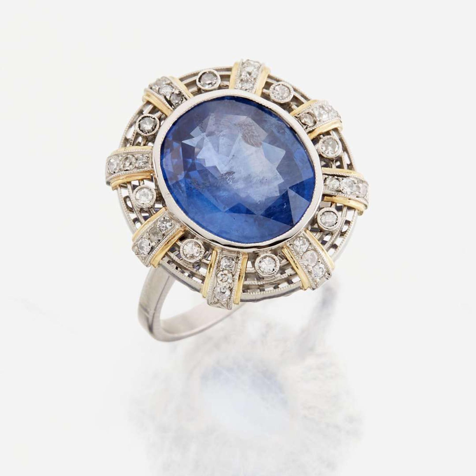 A sapphire, diamond, gold, and platinum ring
