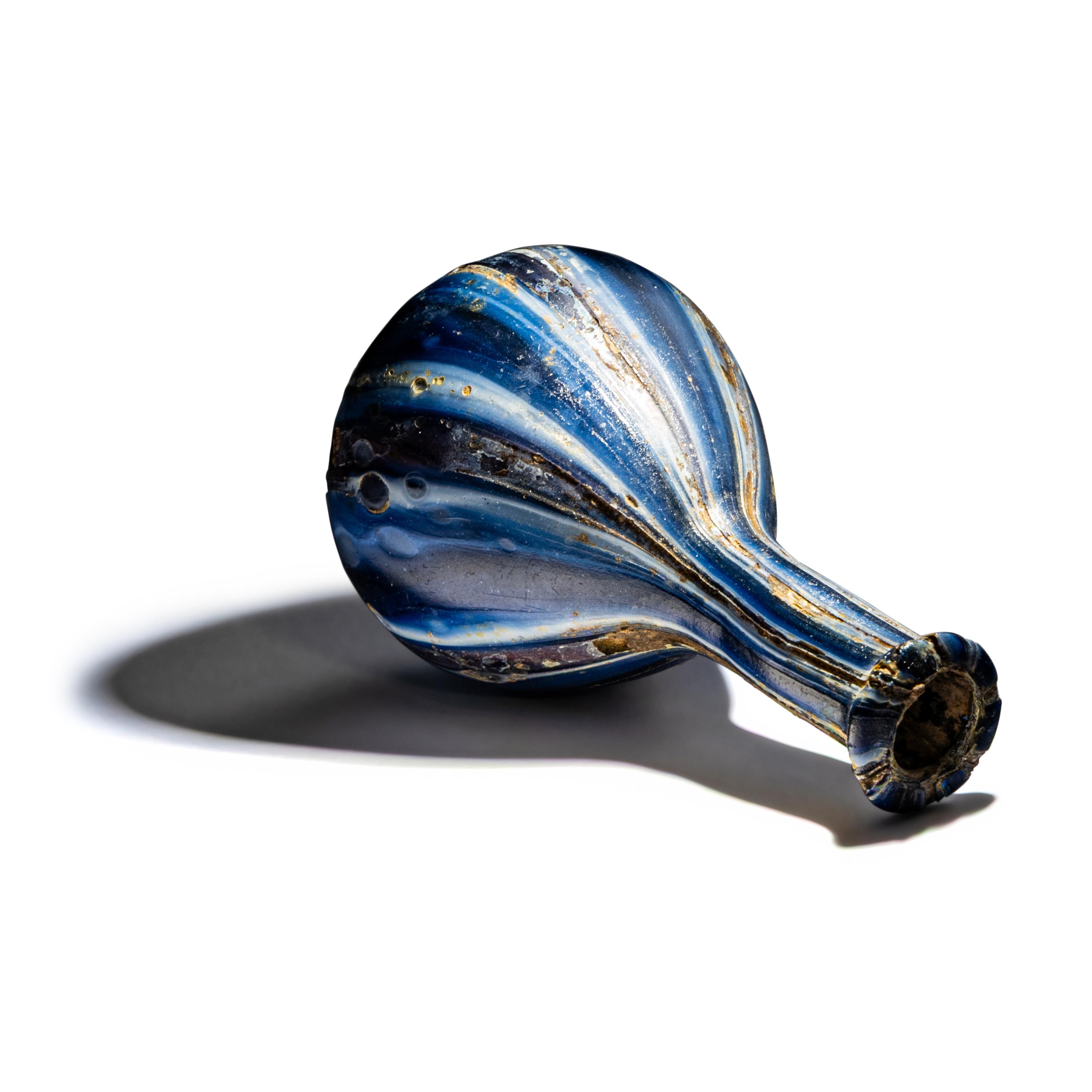 A Roman Marbled Glass Unguentarium