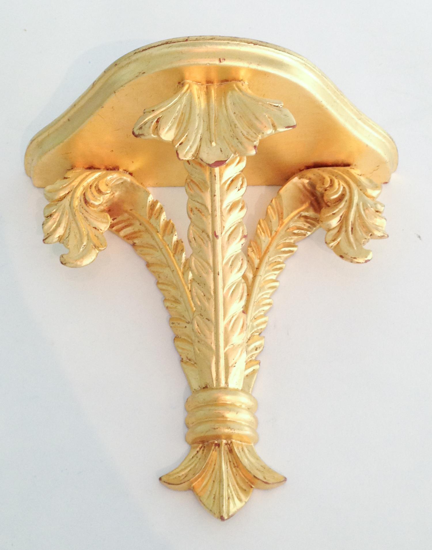 A Group of Three Gilt Painted Wall Mounts Height of tallest 11 1/2 inches.