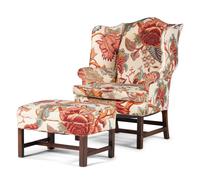 An English Mahogany Wingback Chair and Ottoman