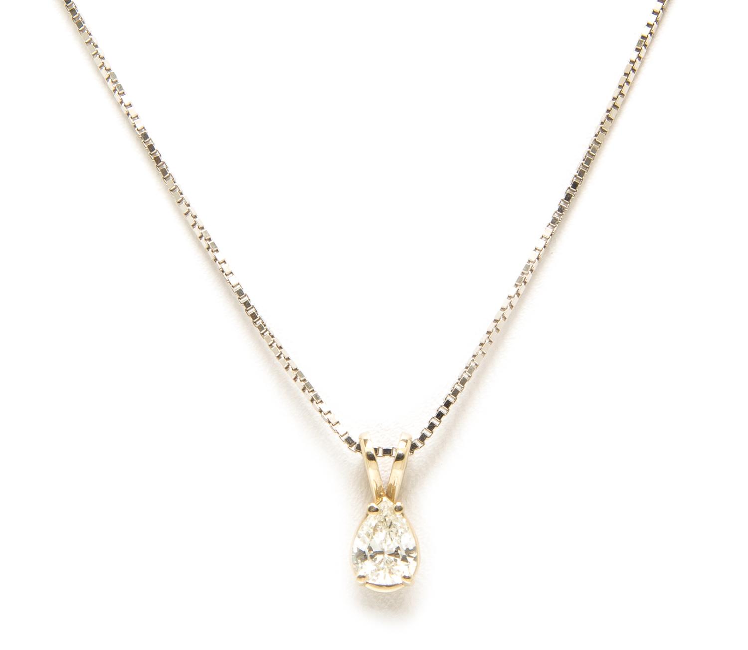 A 14 Karat White Gold and Diamond Solitaire Pendant Necklace, 1.60 dwts.