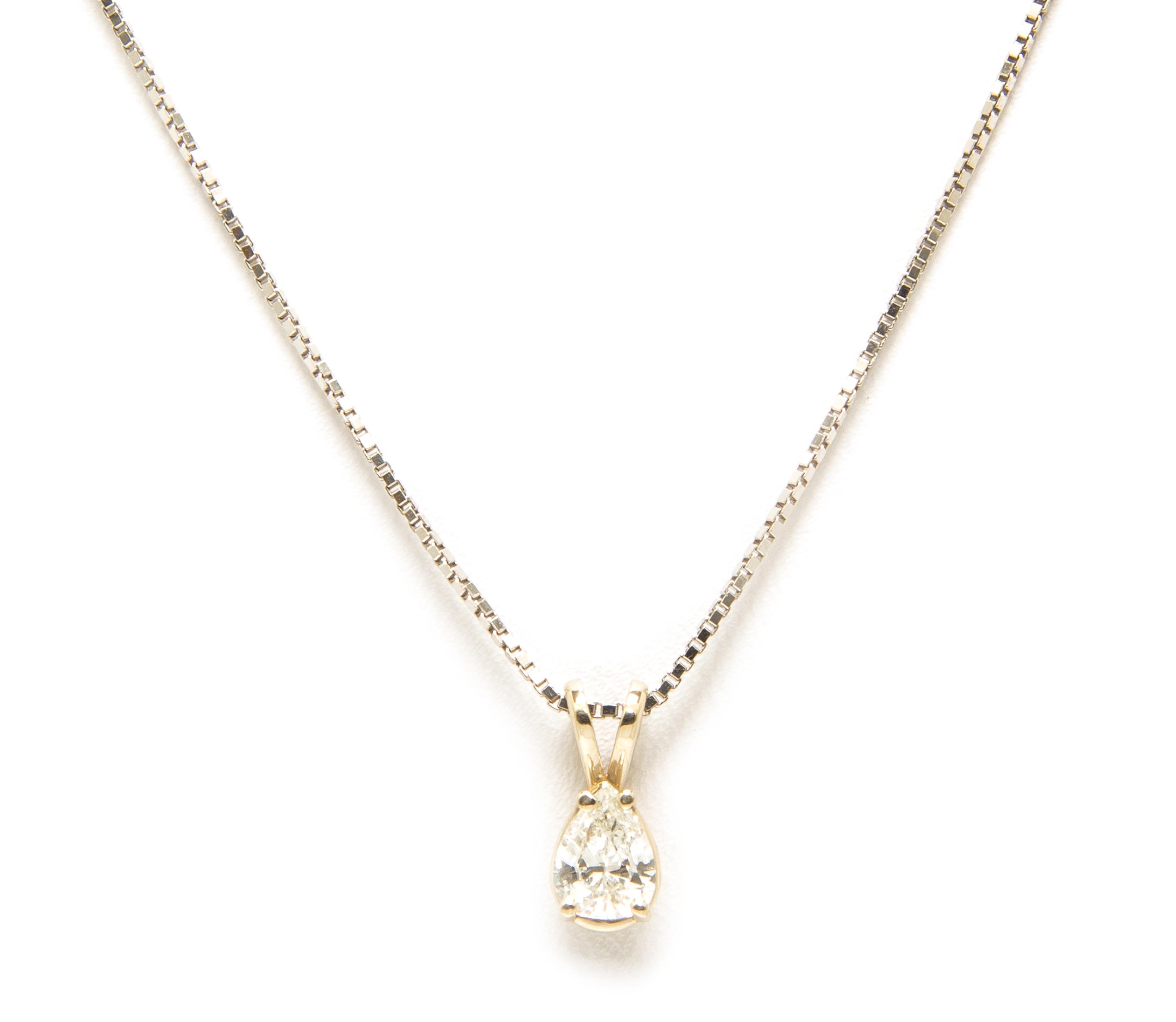 A 14 Karat White Gold and Diamond Solitaire Pendant Necklace, 1.60 dwts.