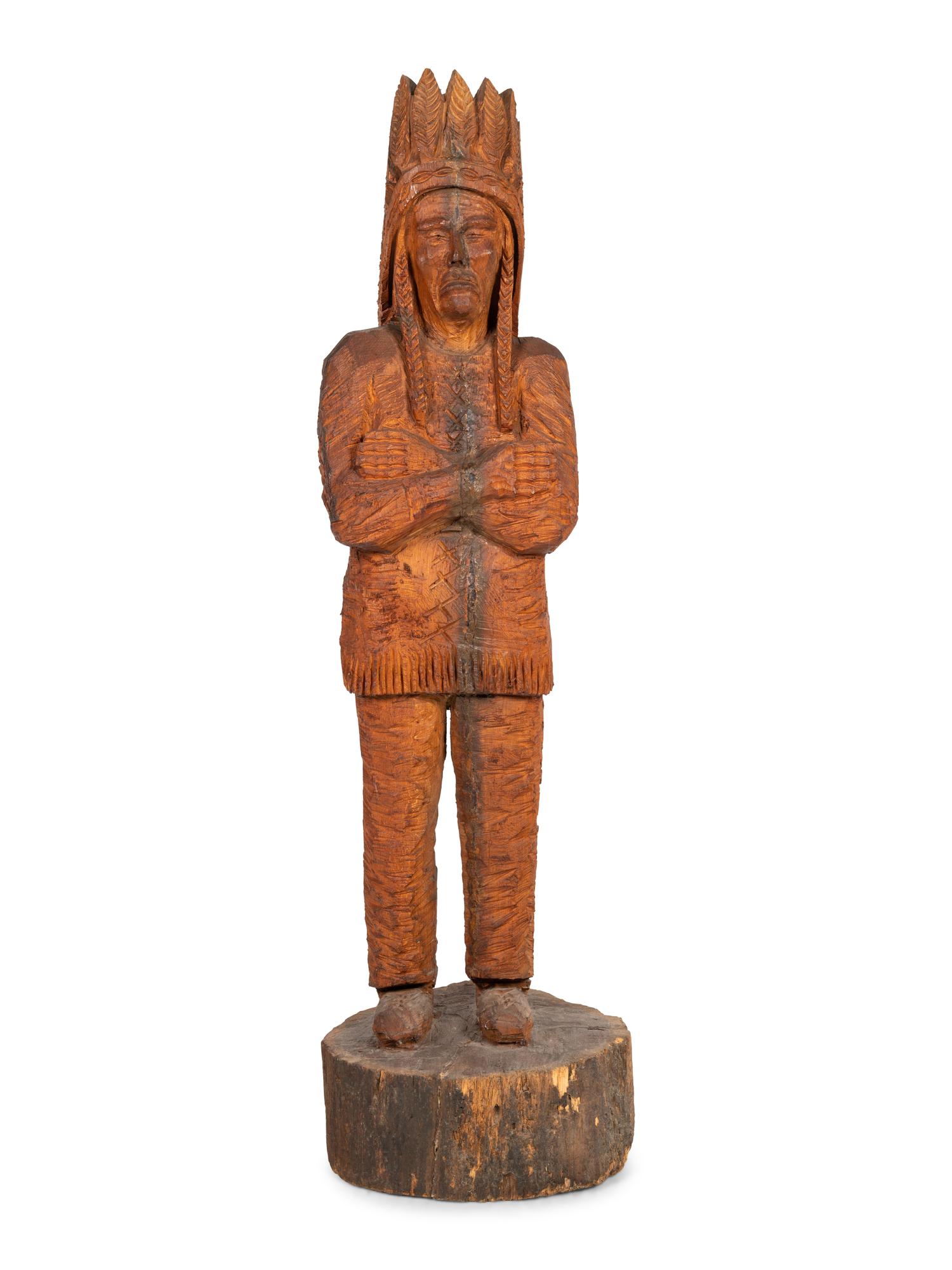 A Carved Wood Figure of an Indian by Don Colp (American, b. 1932)