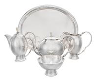 An Austrian Silver Tea and Coffee Service, J.C. Klinkosch, Vienna, comprising a tea pot, a coffee pot, a pitcher, a waste bowl and a tr