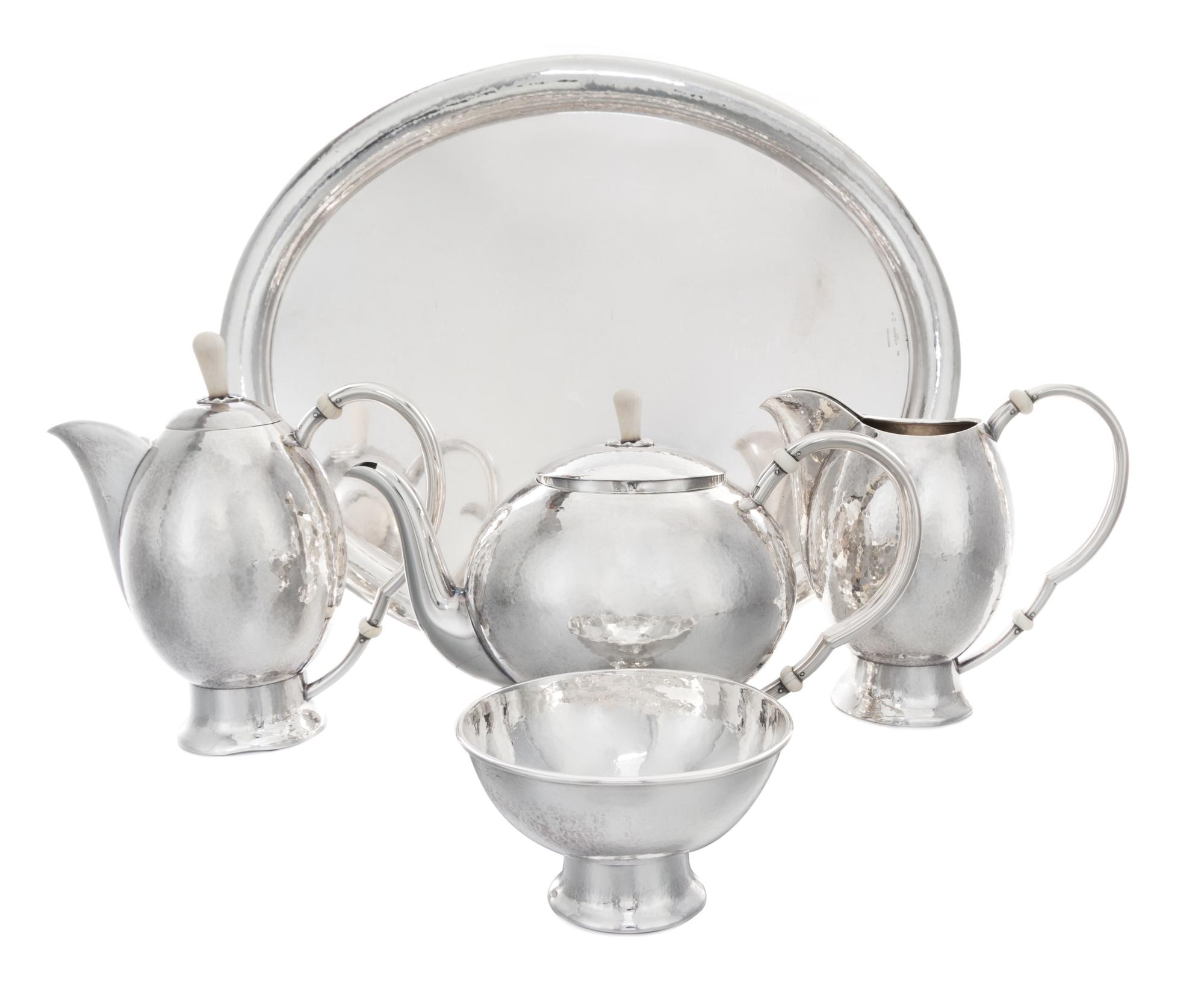 An Austrian Silver Tea and Coffee Service, J.C. Klinkosch, Vienna, comprising a tea pot, a coffee pot, a pitcher, a waste bowl and a tr