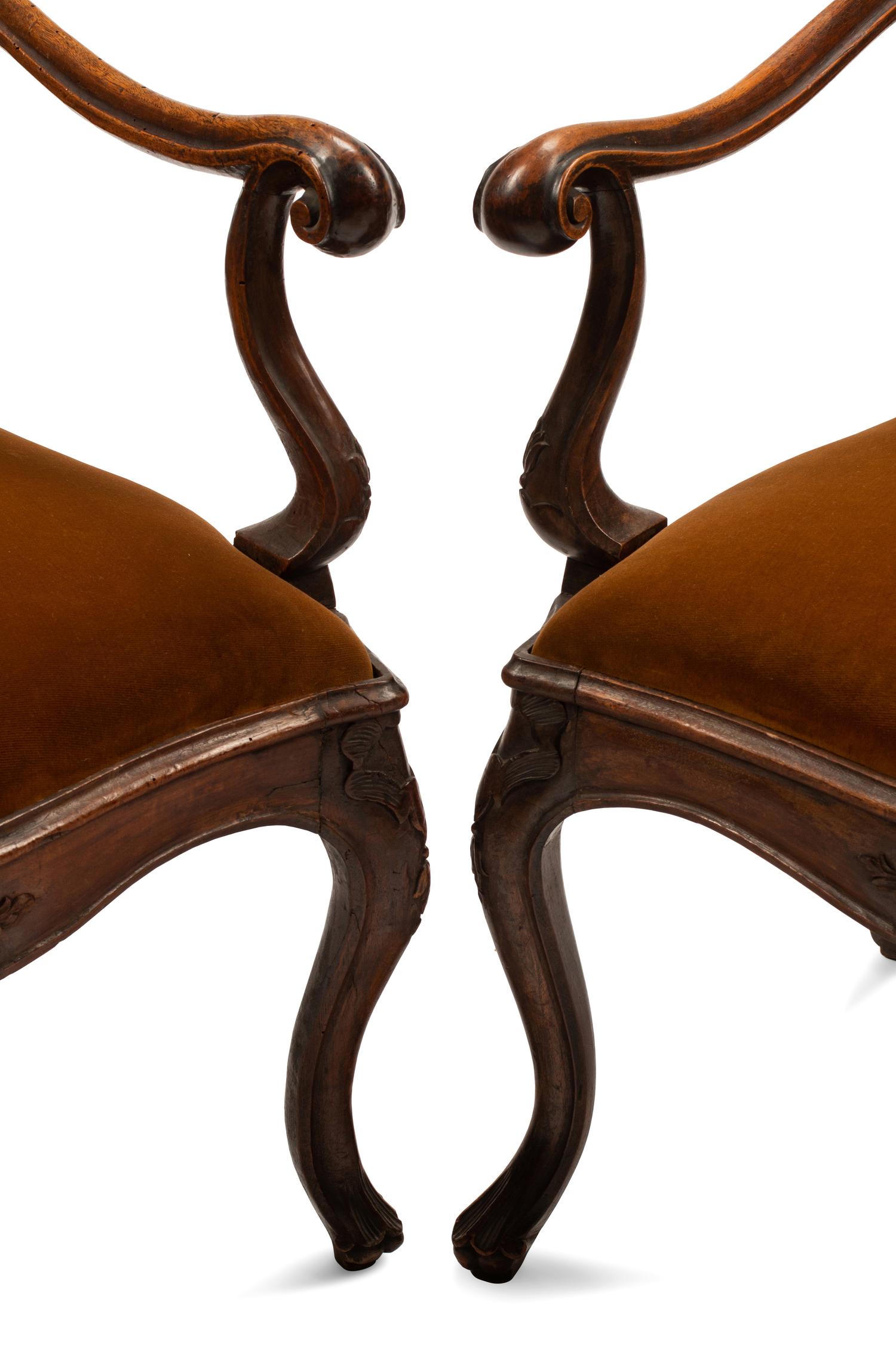 A Pair of Venetian Carved Walnut Armchairs