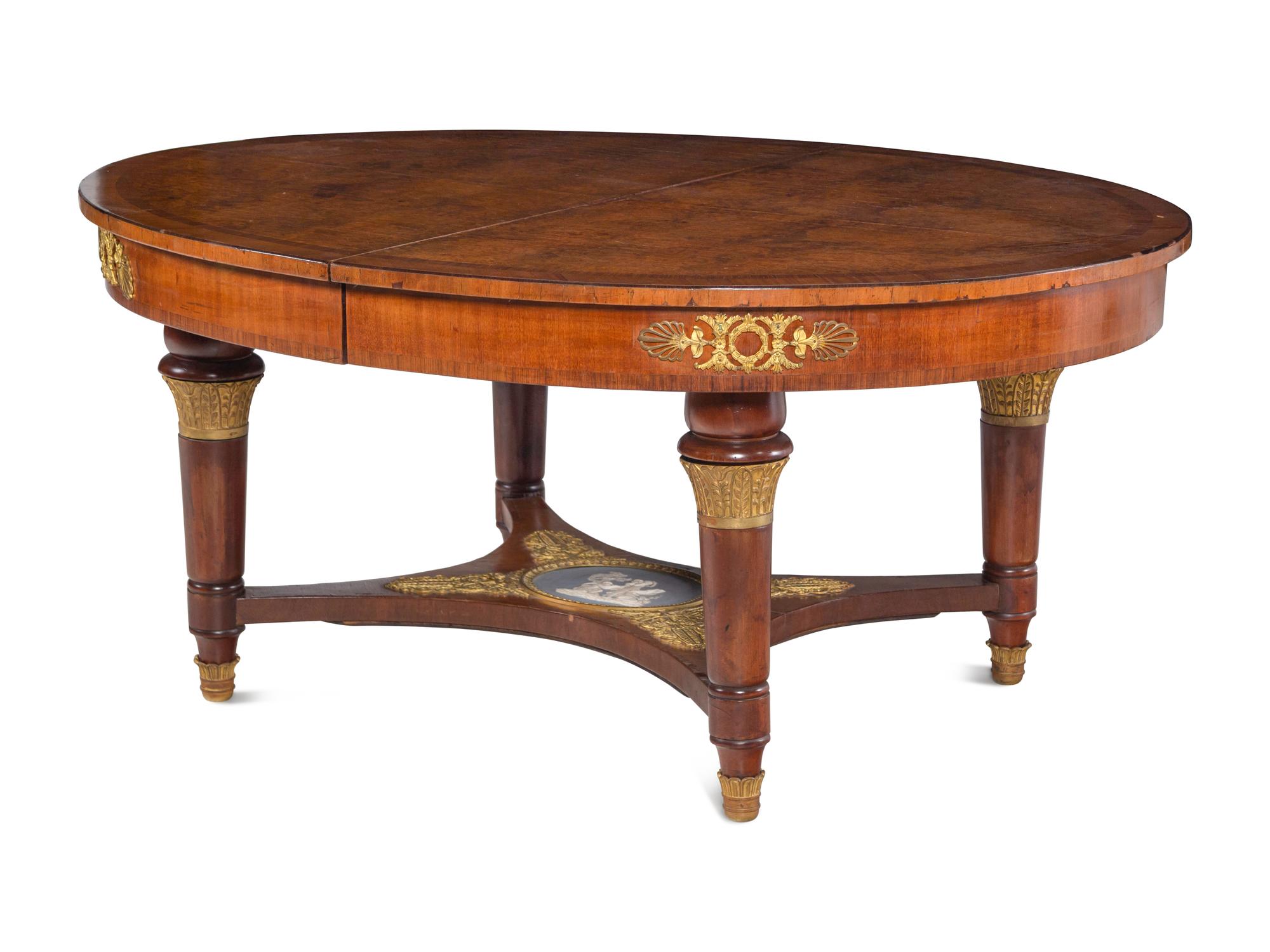 A French Gilt Bronze and Jasperware Mounted Burlwood Dining Suite
