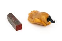 A Chinese Bloodstone Seal and A Yellow Hardstone Snuff Bottle