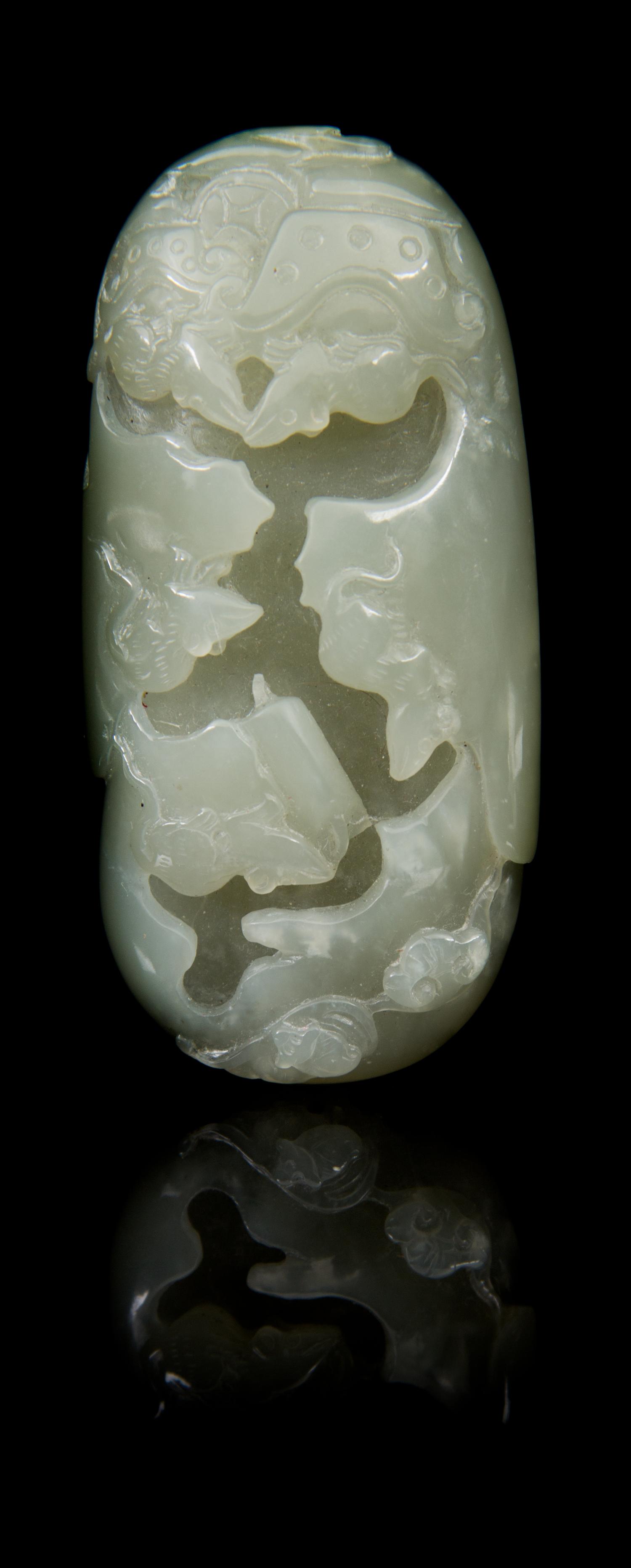 A Carved Jade Toggle Length 3 1/4 inches.