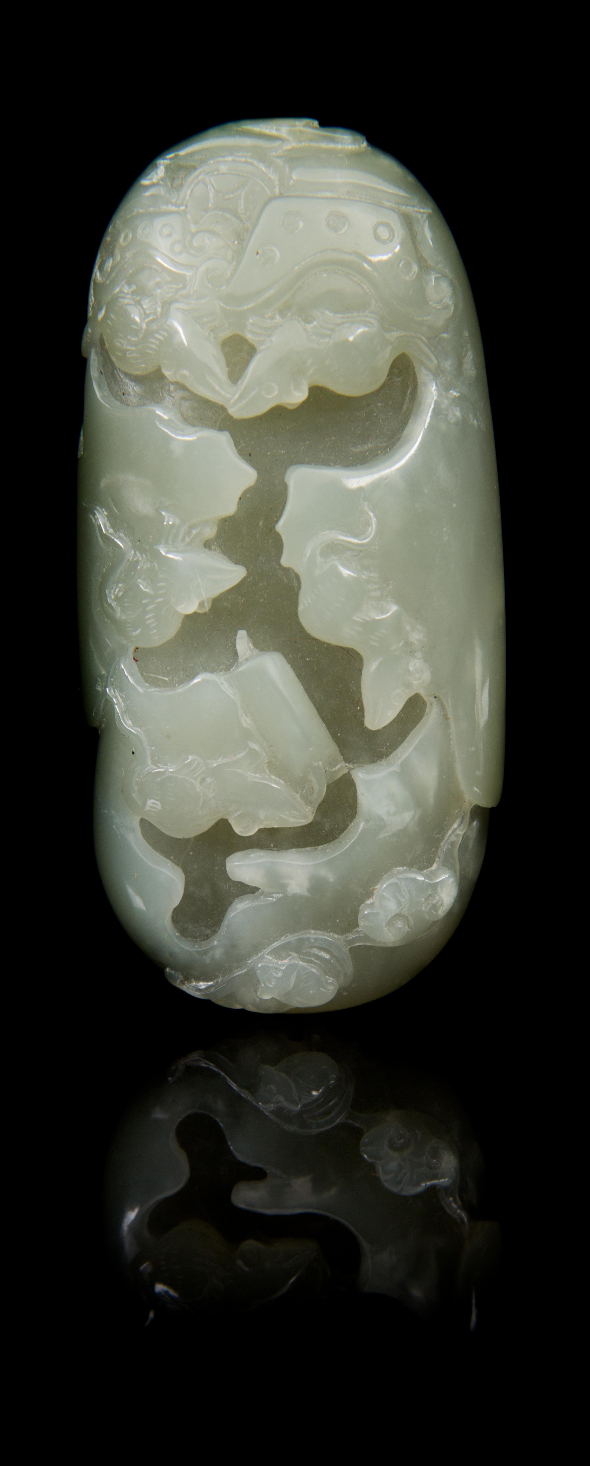 A Carved Jade Toggle Length 3 1/4 inches.
