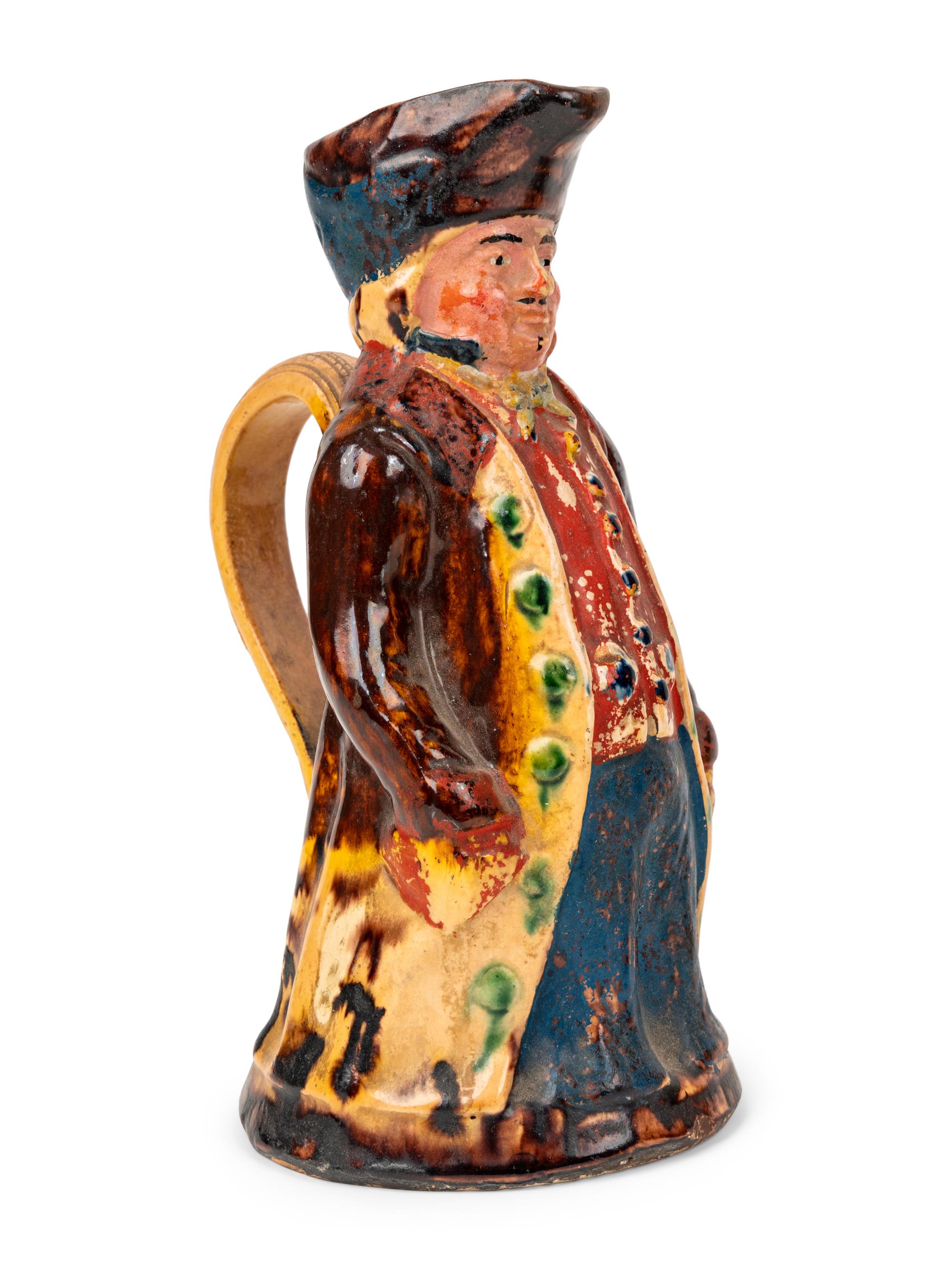 An Italian Giacobino & Rosso-Torino Figural Glass Vermouth Bottle and a Toby Jug