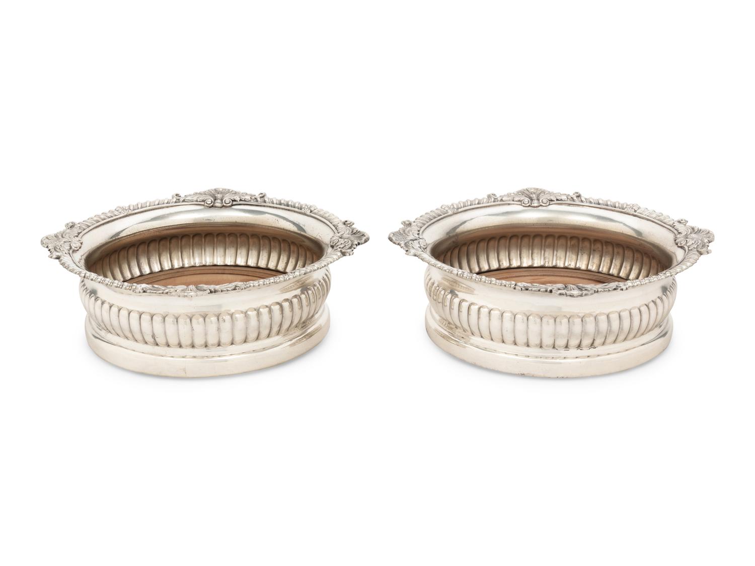 A Pair of Paul Storr Silver Mounted Wine Coasters