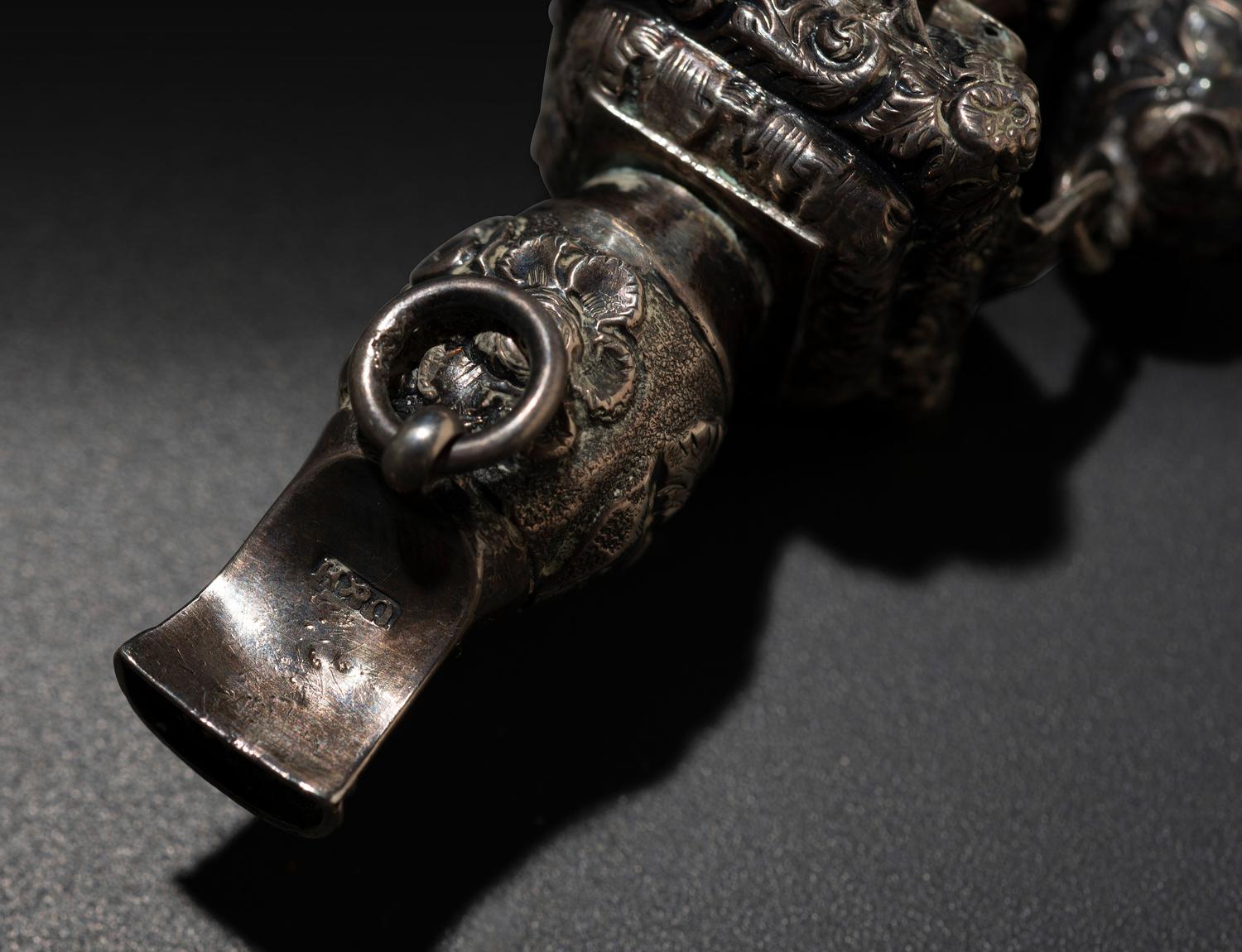 A Silver and Coral Mounted Child's Rattle Whistle