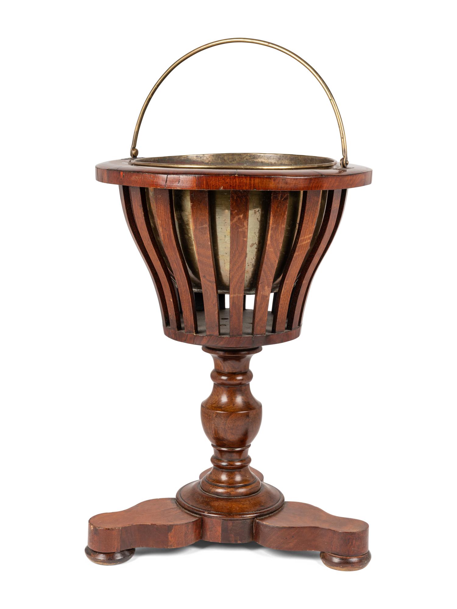 A Regency Style Mahogany Jardinière with Brass Liner
