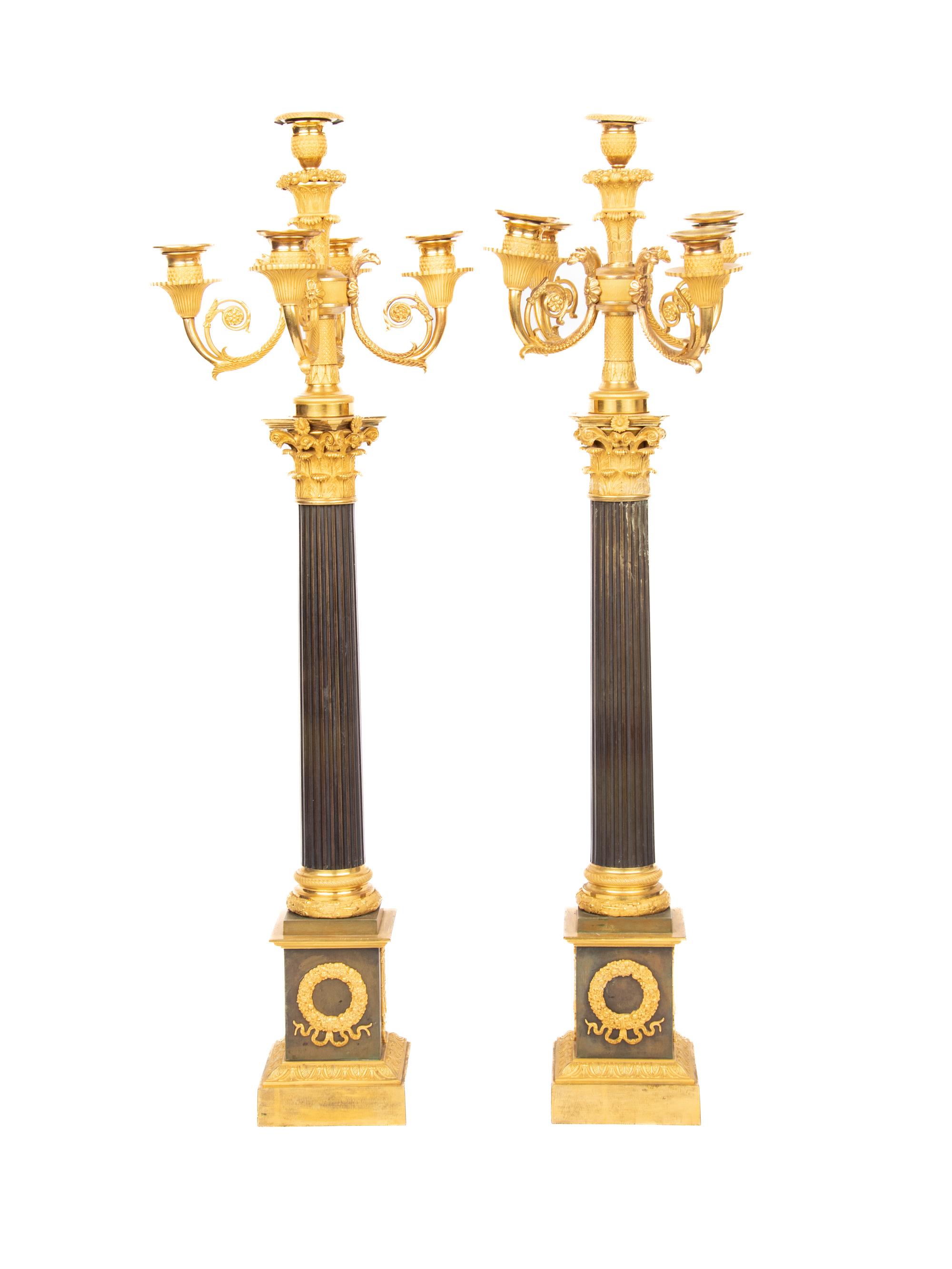 A Pair of Directoire Style Gilt and Patinated Bronze Five-Light Candelabra