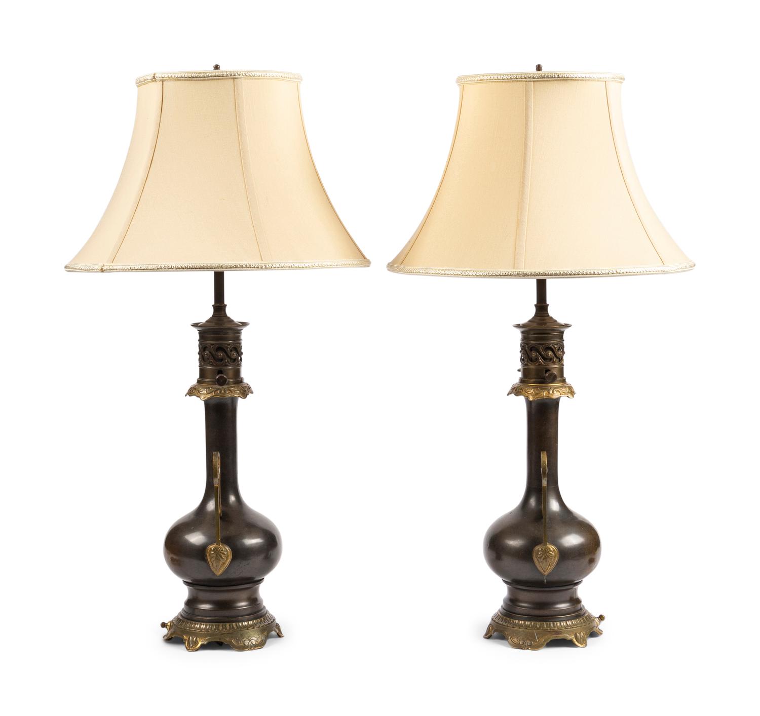 A Pair of French Gilt and Patinated Cast Metal Table Lamps
