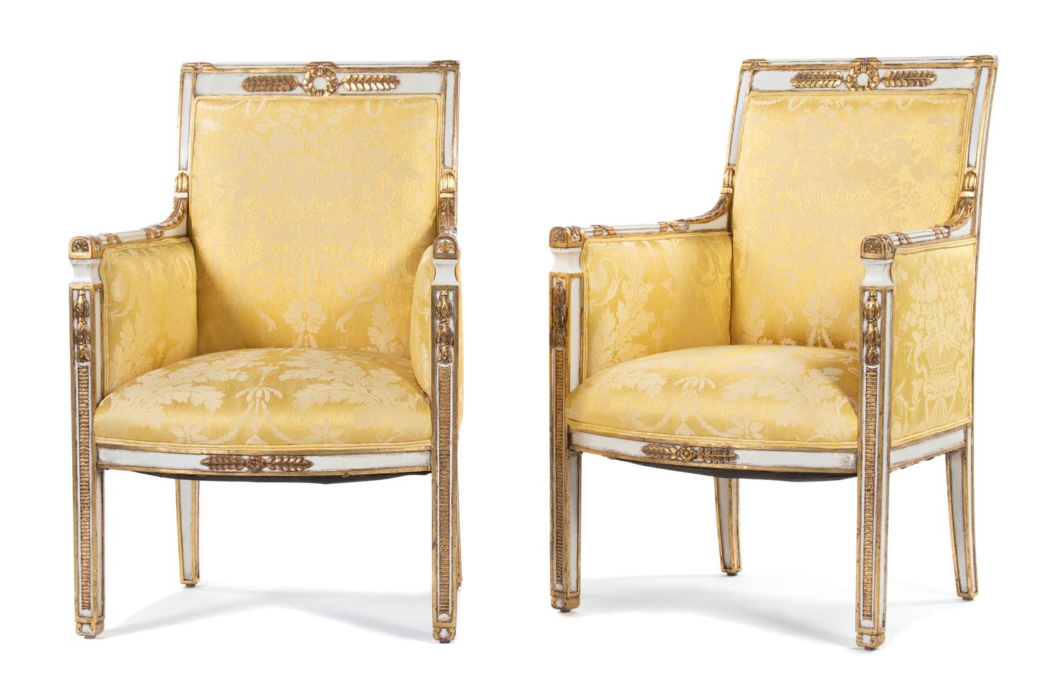 A Pair of Directoire Style Parcel-Gilt and Cream-Painted Armchairs