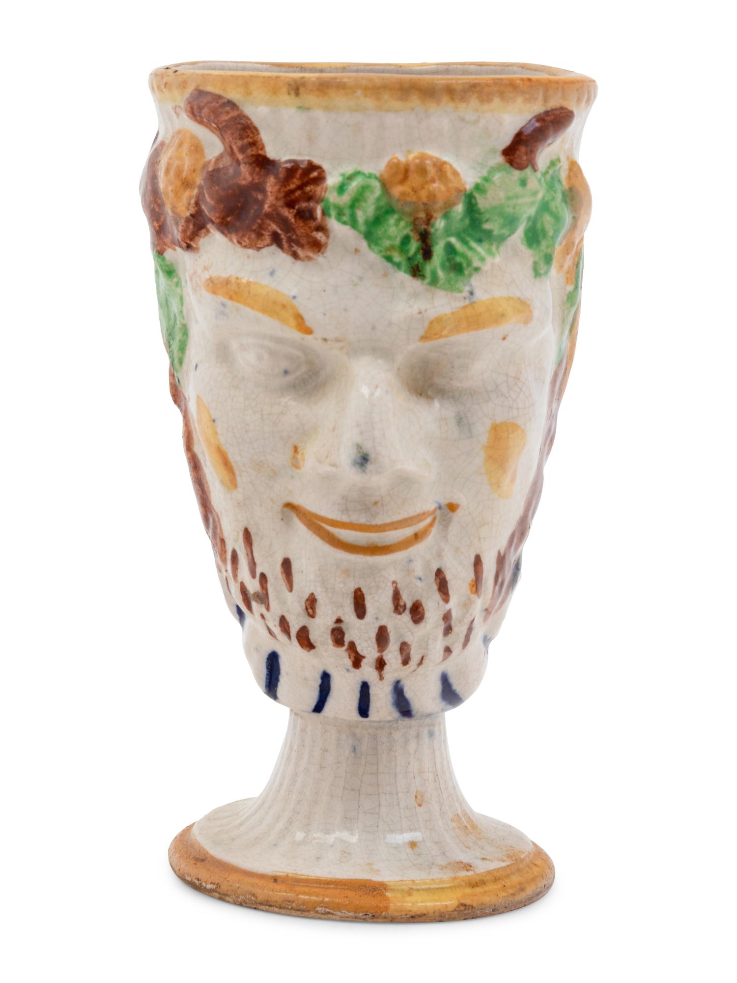 A Staffordshire Pottery Satyr Mug with an Interior Frog