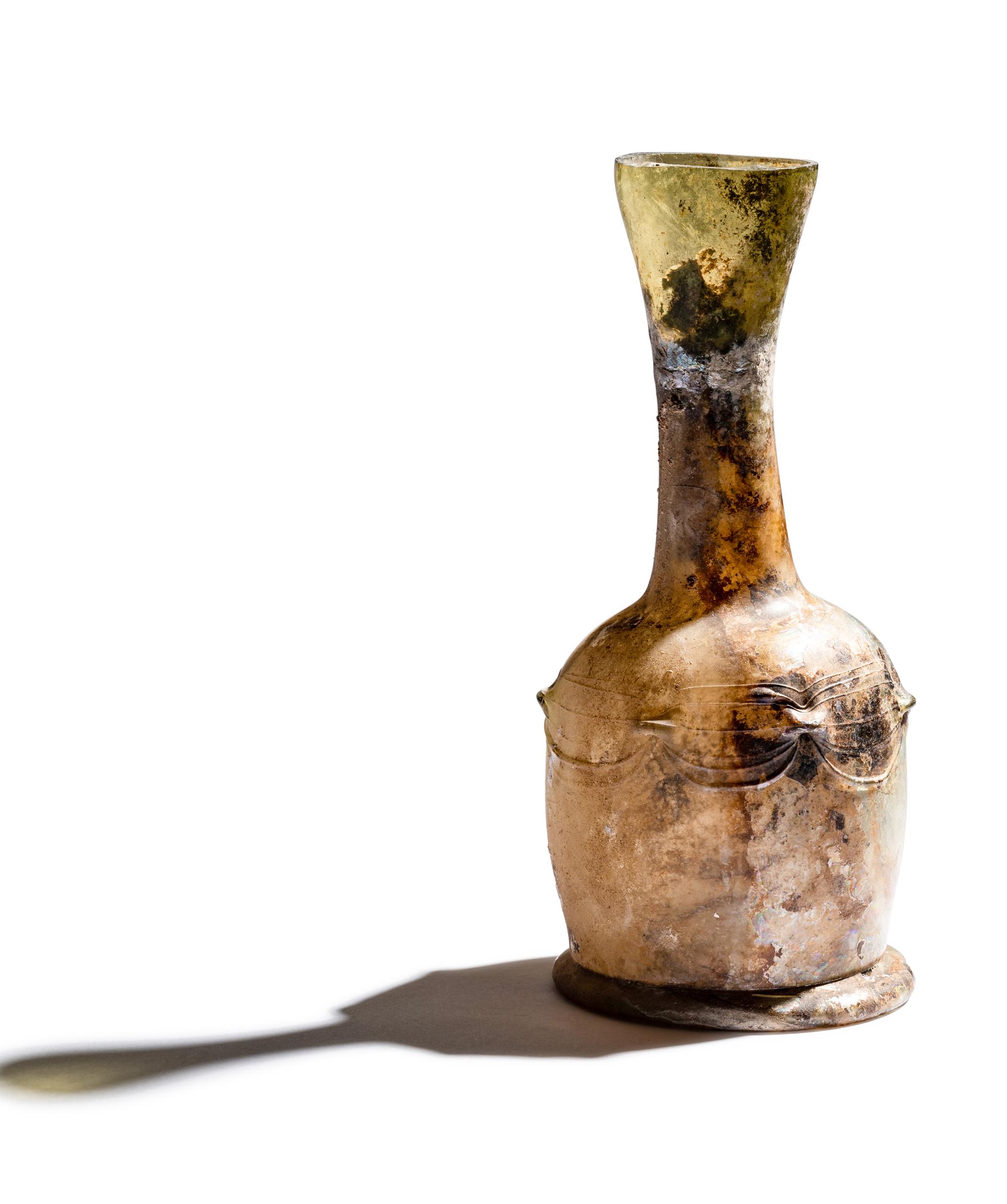 A Roman Glass Unguentarium with Six Knobs