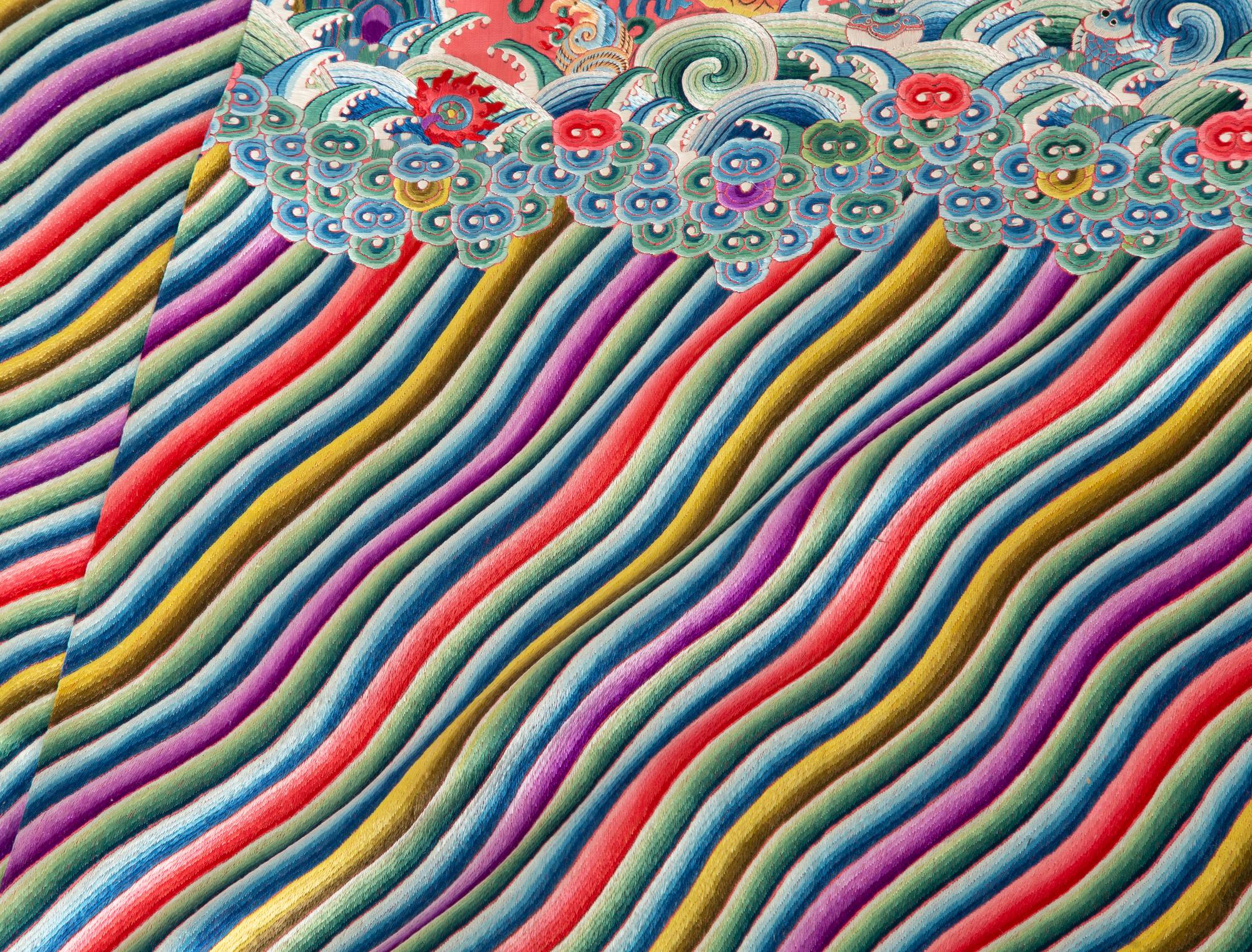 A Chinese Embroidered Pink Silk Dragon Robe