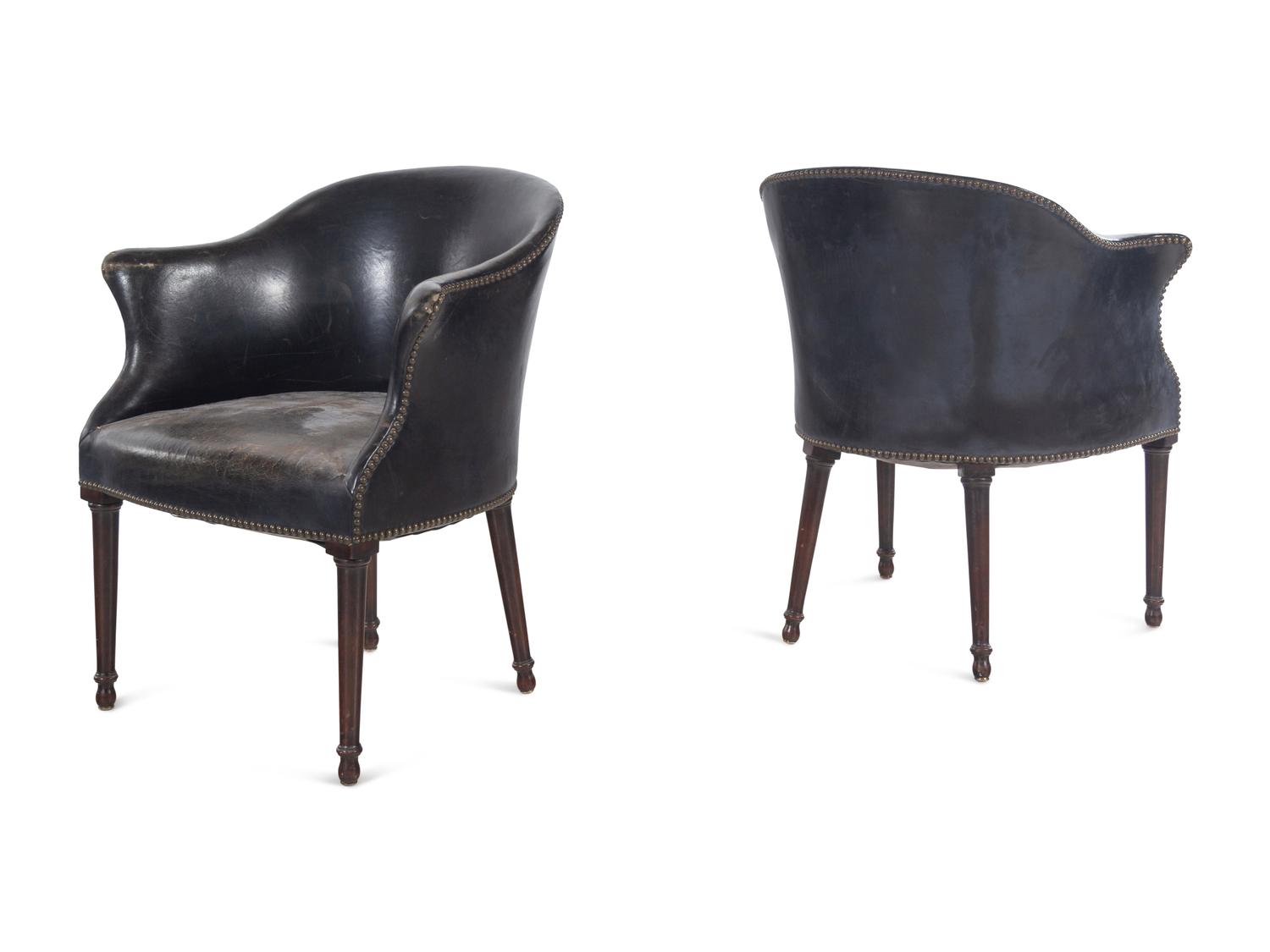 A Set of Four Leather Upholstered Armchairs