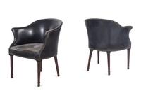 A Set of Four Leather Upholstered Armchairs