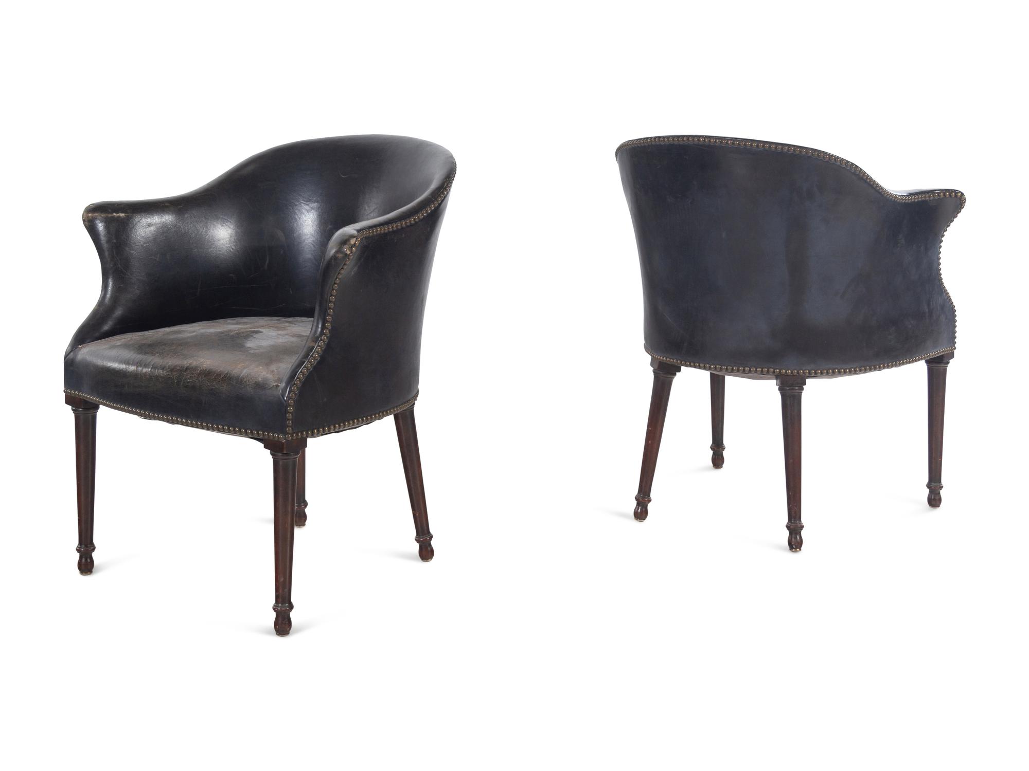 A Set of Four Leather Upholstered Armchairs