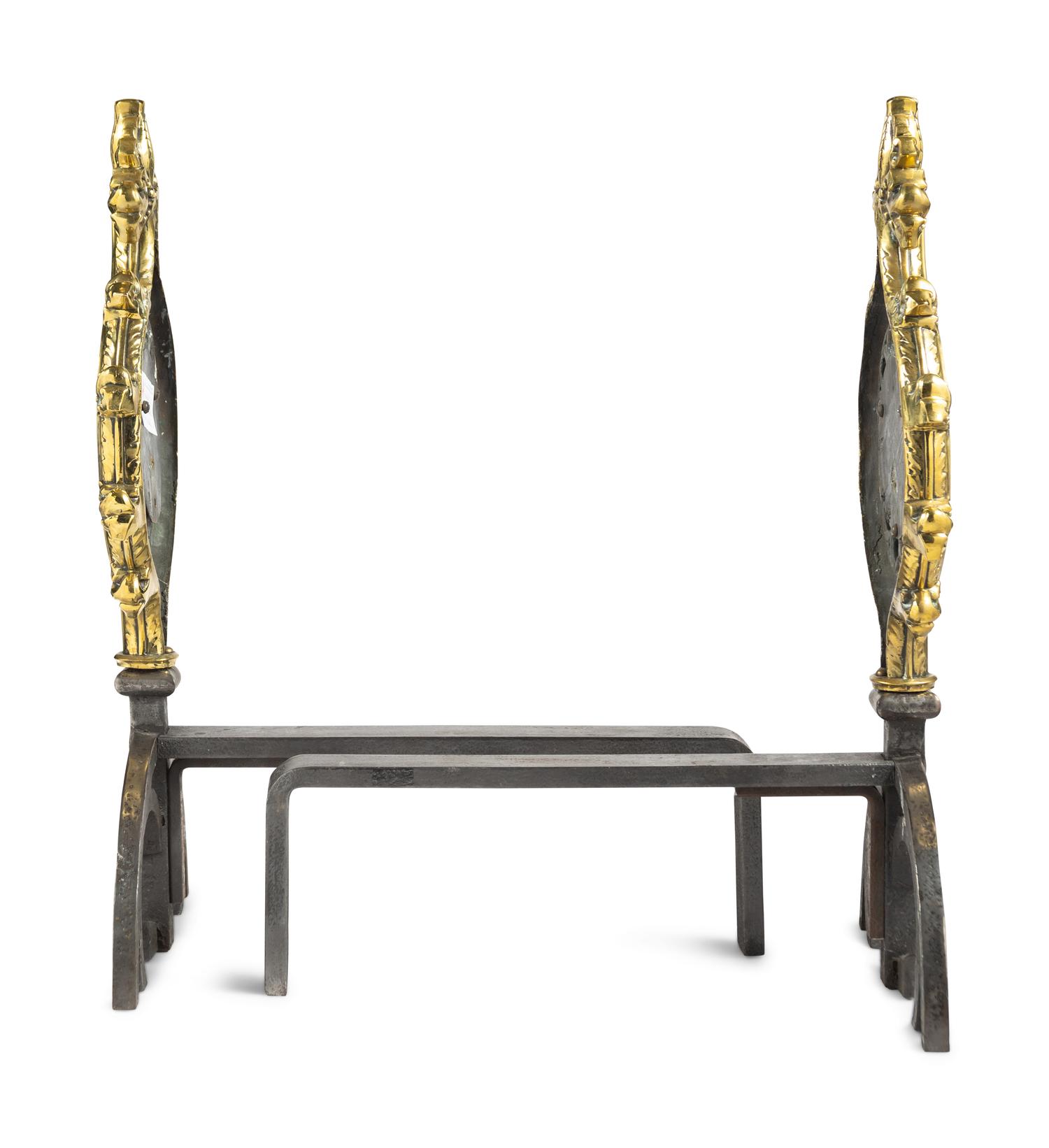 A Pair of Gothic Style Brass and Steel Andirons
