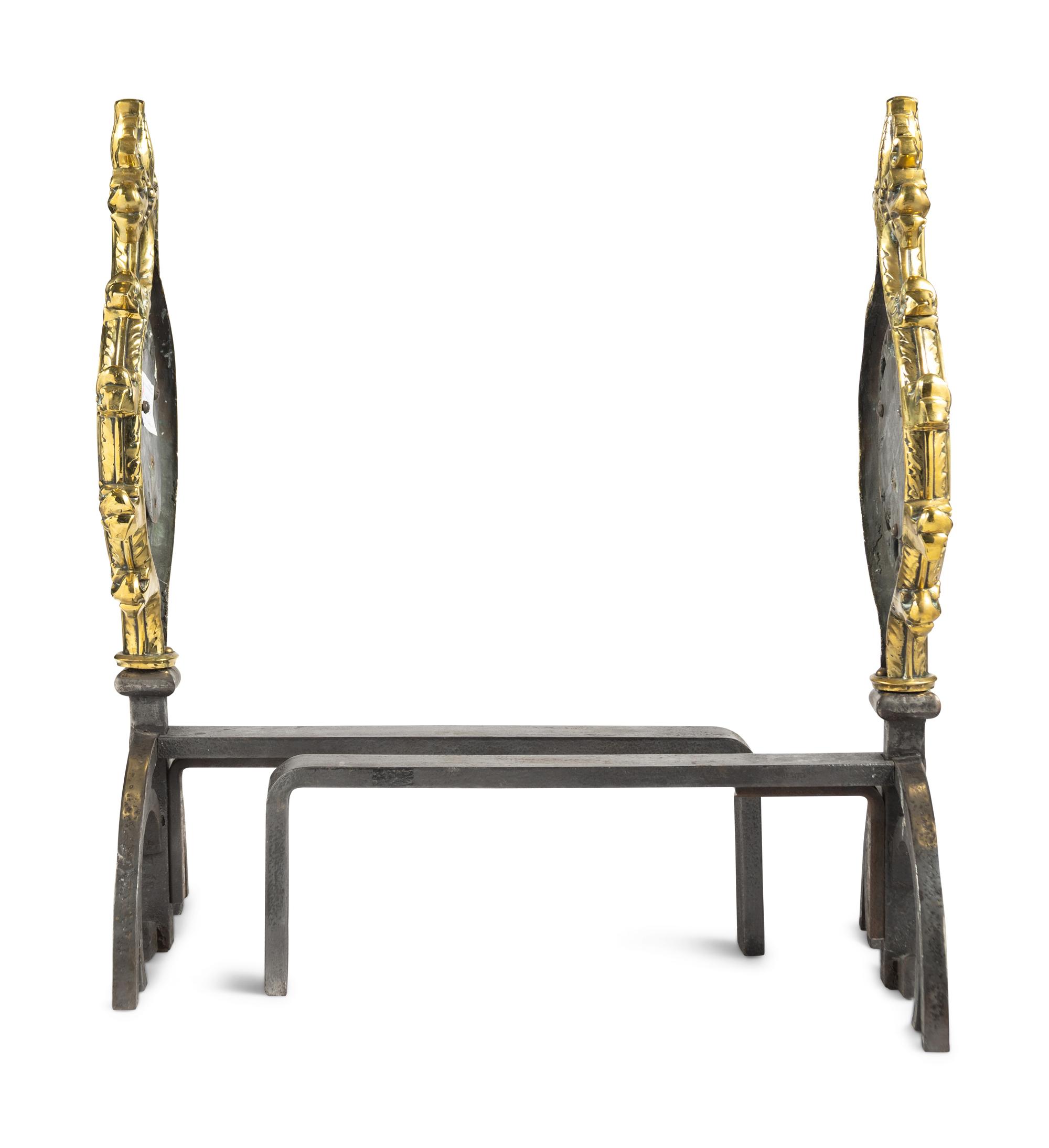 A Pair of Gothic Style Brass and Steel Andirons