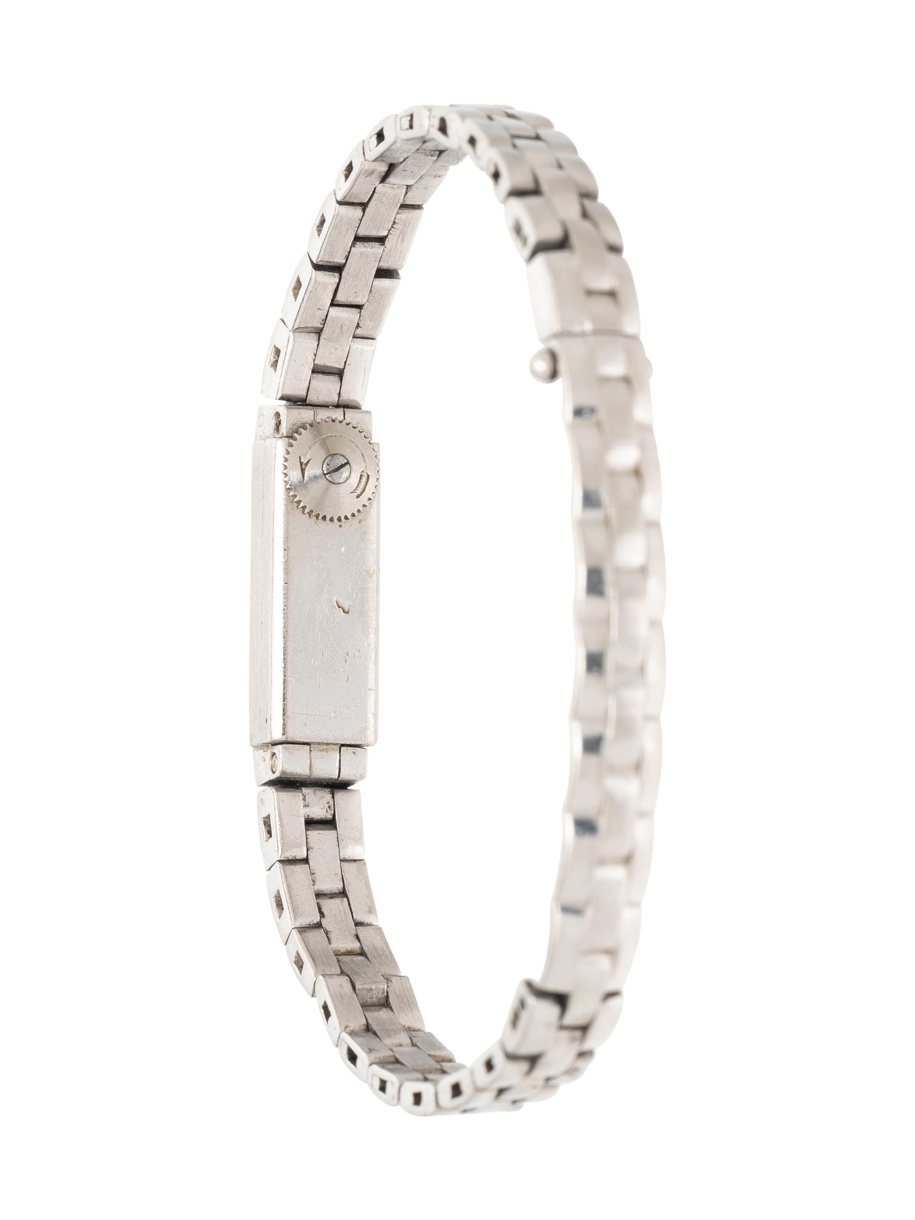 CARTIER, PLATINUM AND WHITE GOLD MINI WATCH