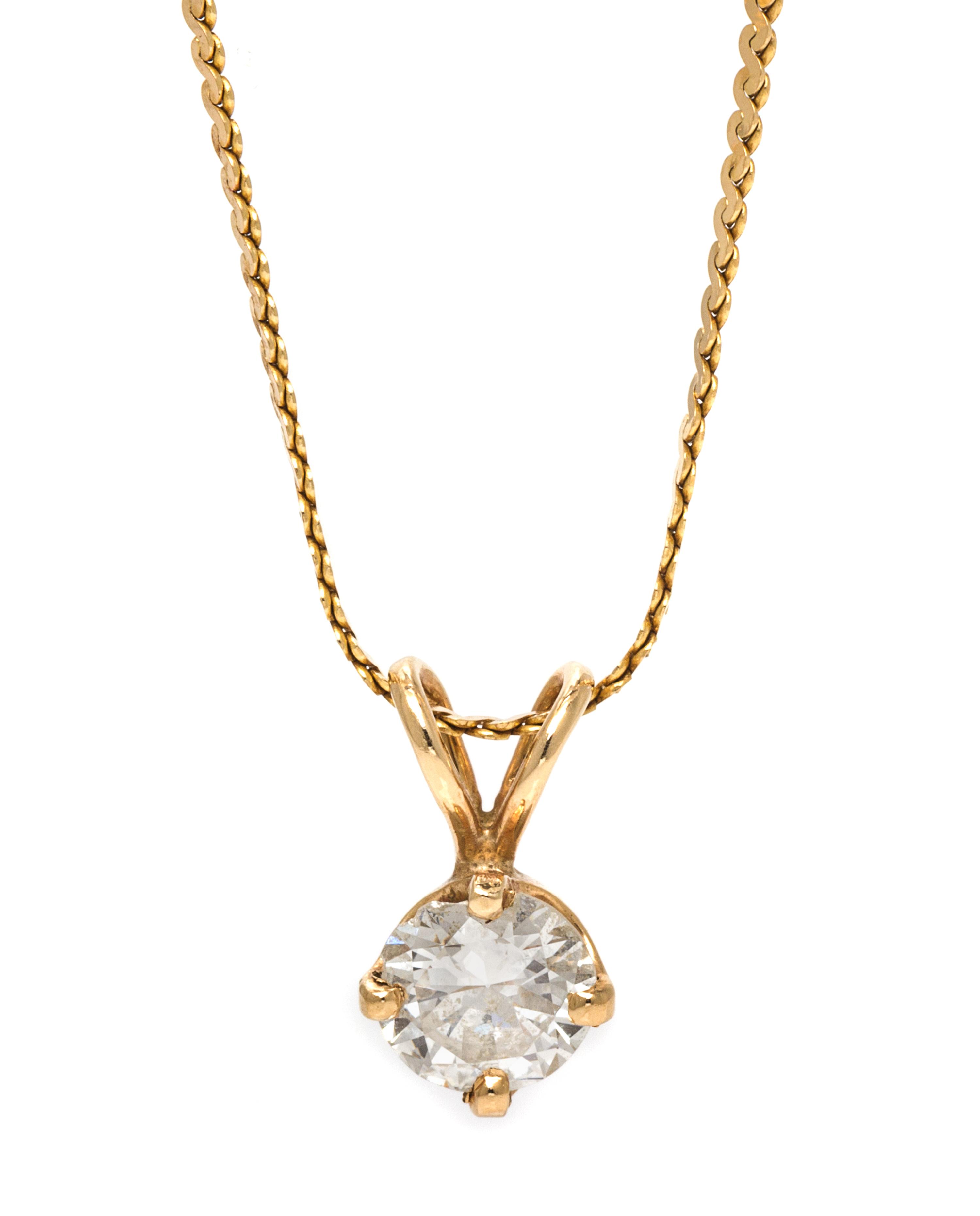 A Yellow Gold and Diamond Solitaire Pendant, 3.30 dwts.