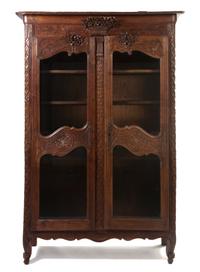 A French Provincial Oak Vitrine, Height 82 x width 50 x depth 19 inches.