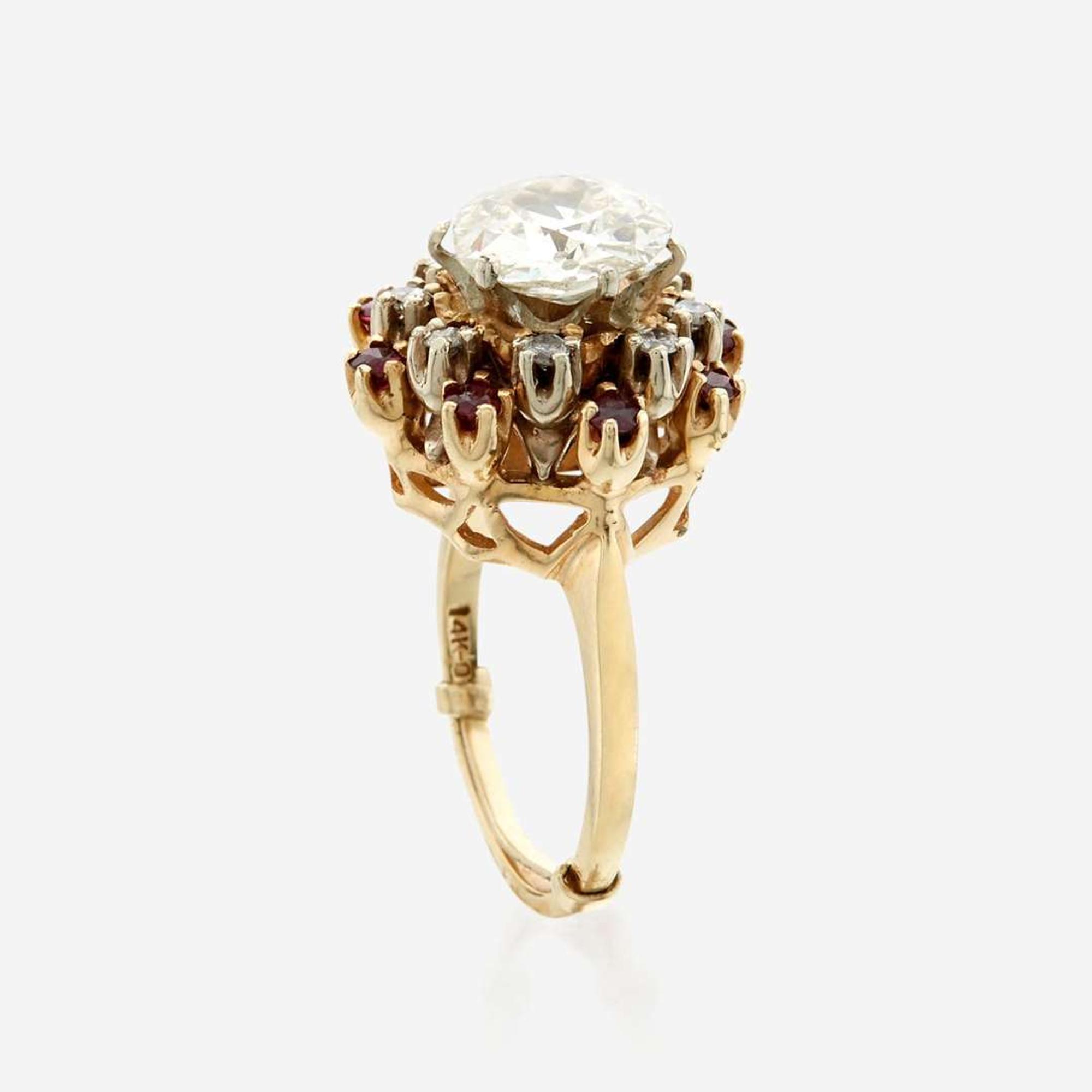 A diamond, ruby, and gold ring