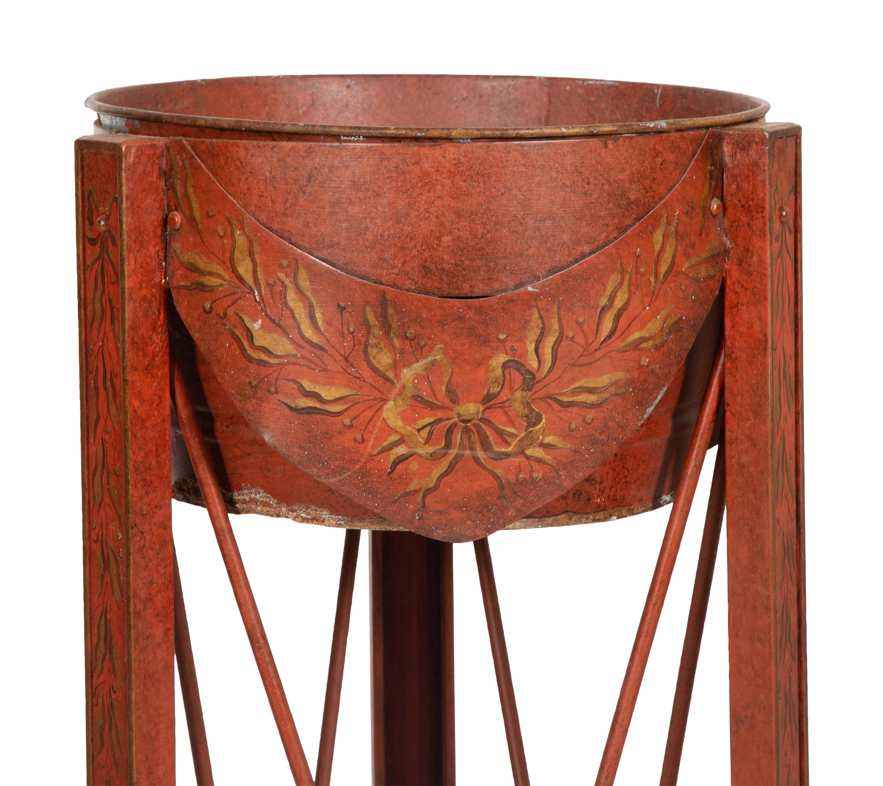 A Pair of Red and Gold Tole Peinte Jardiniere Stands