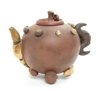 A Chinese Yixing Pottery Teapot Height 5 1/2 inches. — 20TH CENTURY