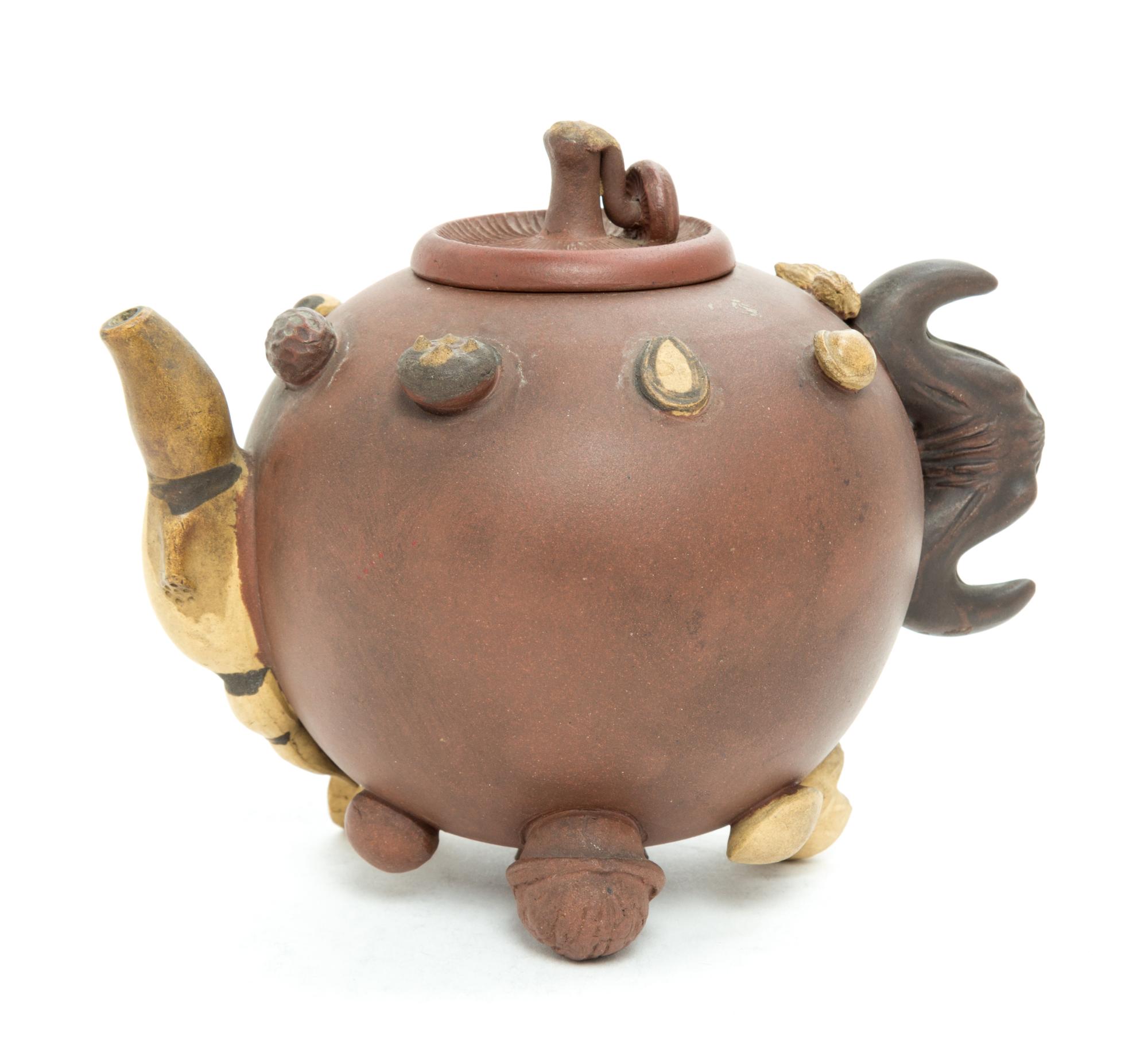 A Chinese Yixing Pottery Teapot Height 5 1/2 inches. — 20TH CENTURY