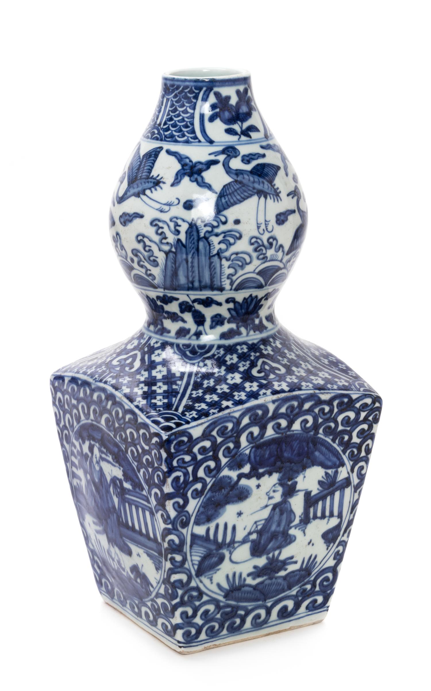 A Chinese Blue and White Gourd-Form Porcelain Vase Height 16 inches. — 20TH CENTURY
