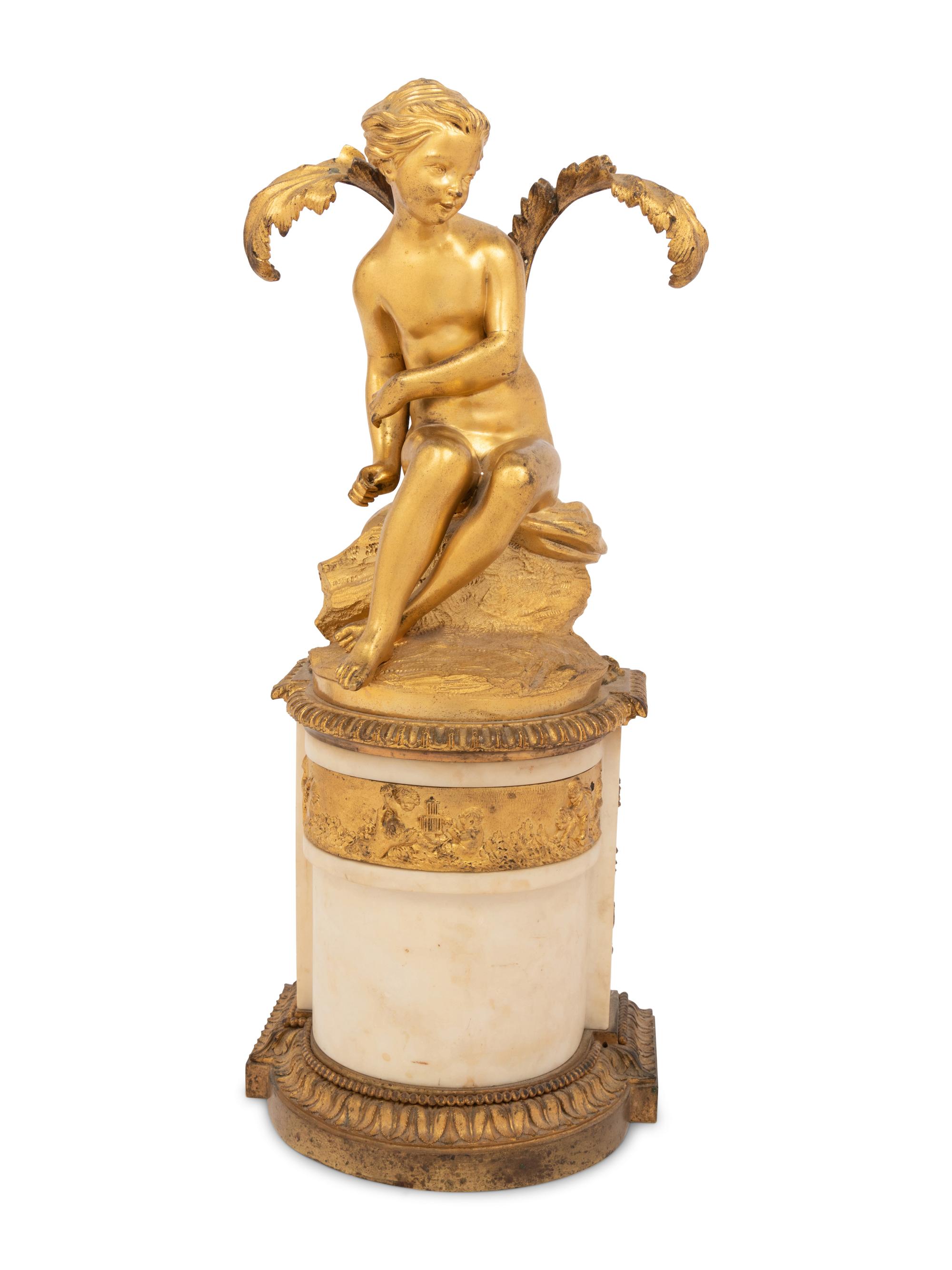 A Continental Gilt Bronze and Marble Figural Ornament