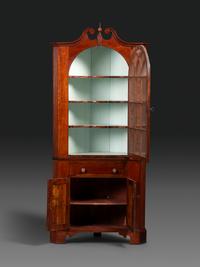 A Late Chippendale Carved Cherrywood Corner Cupboard