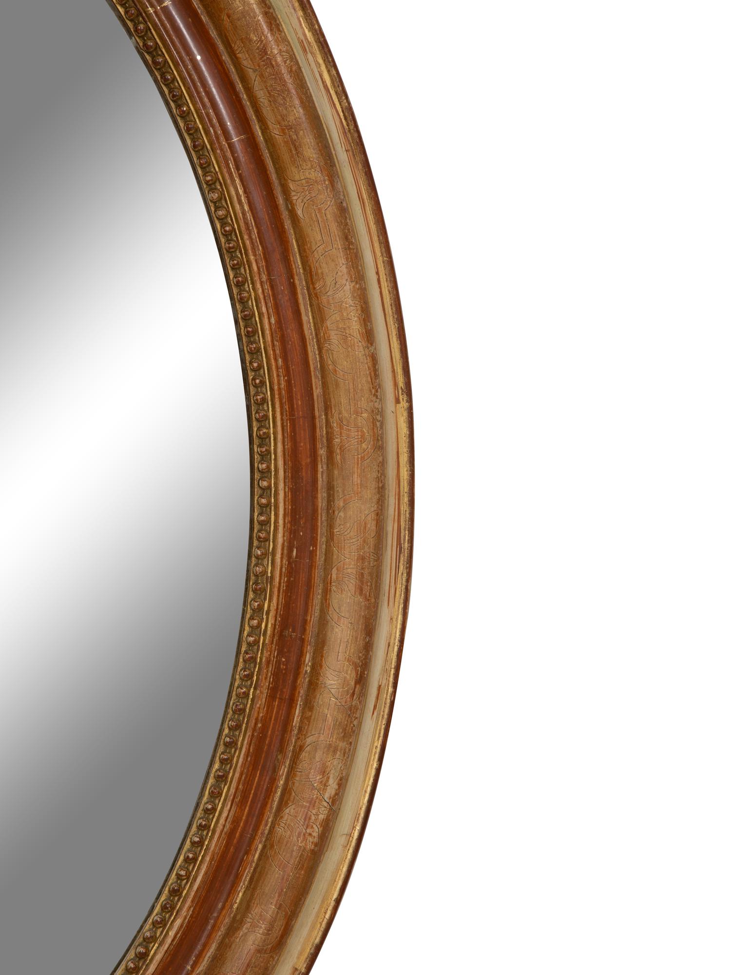 A Napoleon III Giltwood Oval Mirror