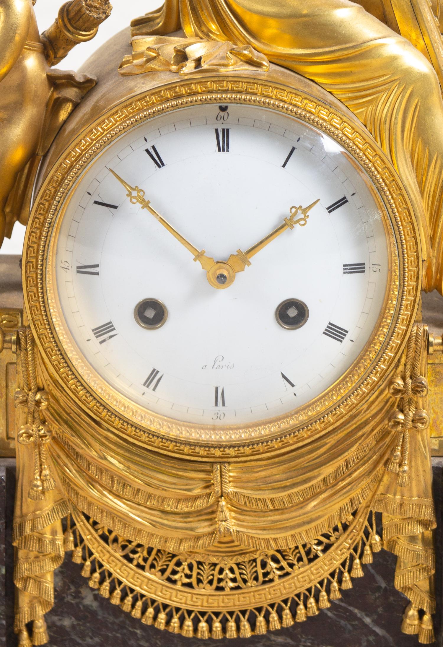 An Empire Gilt Bronze and Marble Figural Mantel Clock
