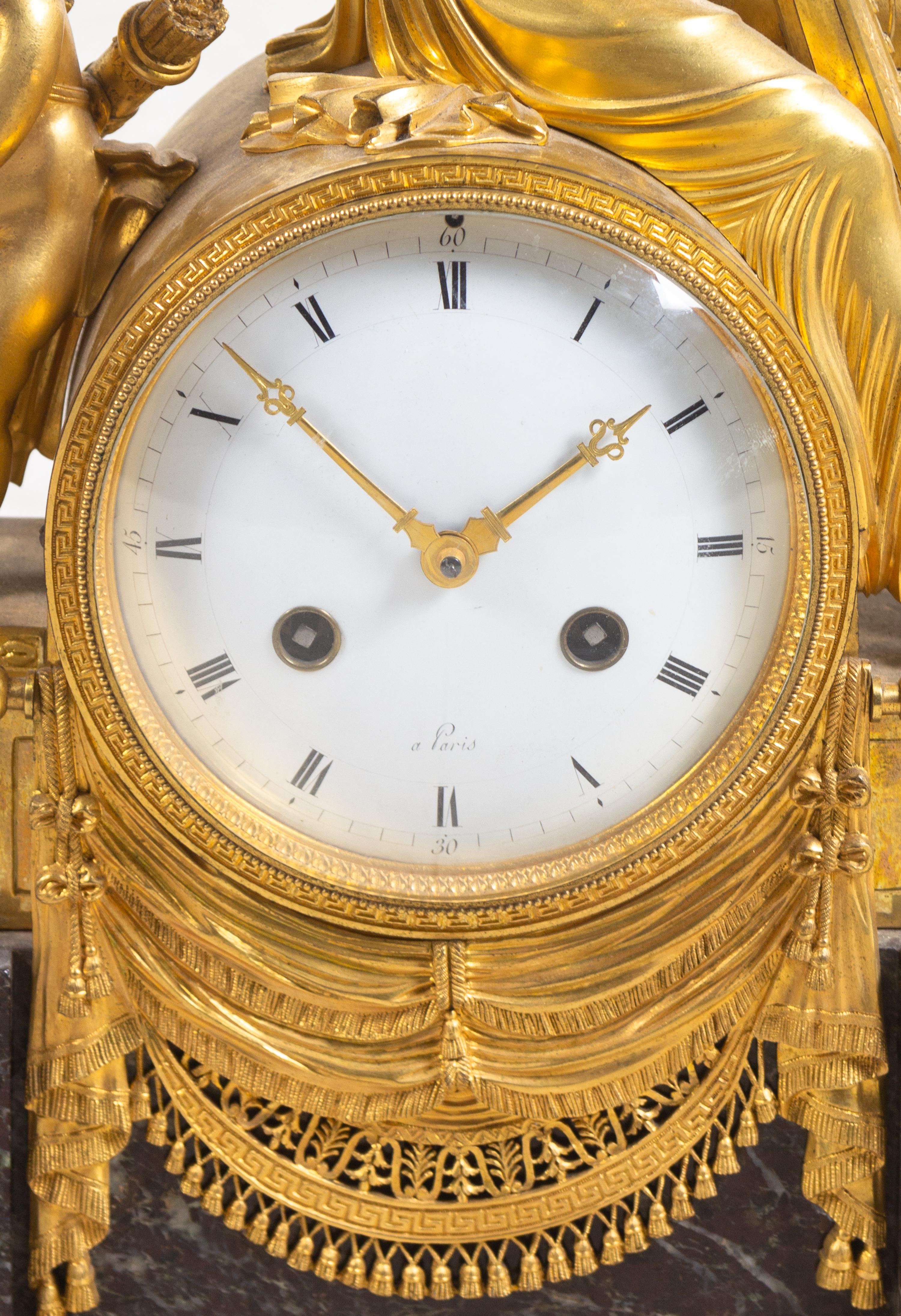 An Empire Gilt Bronze and Marble Figural Mantel Clock