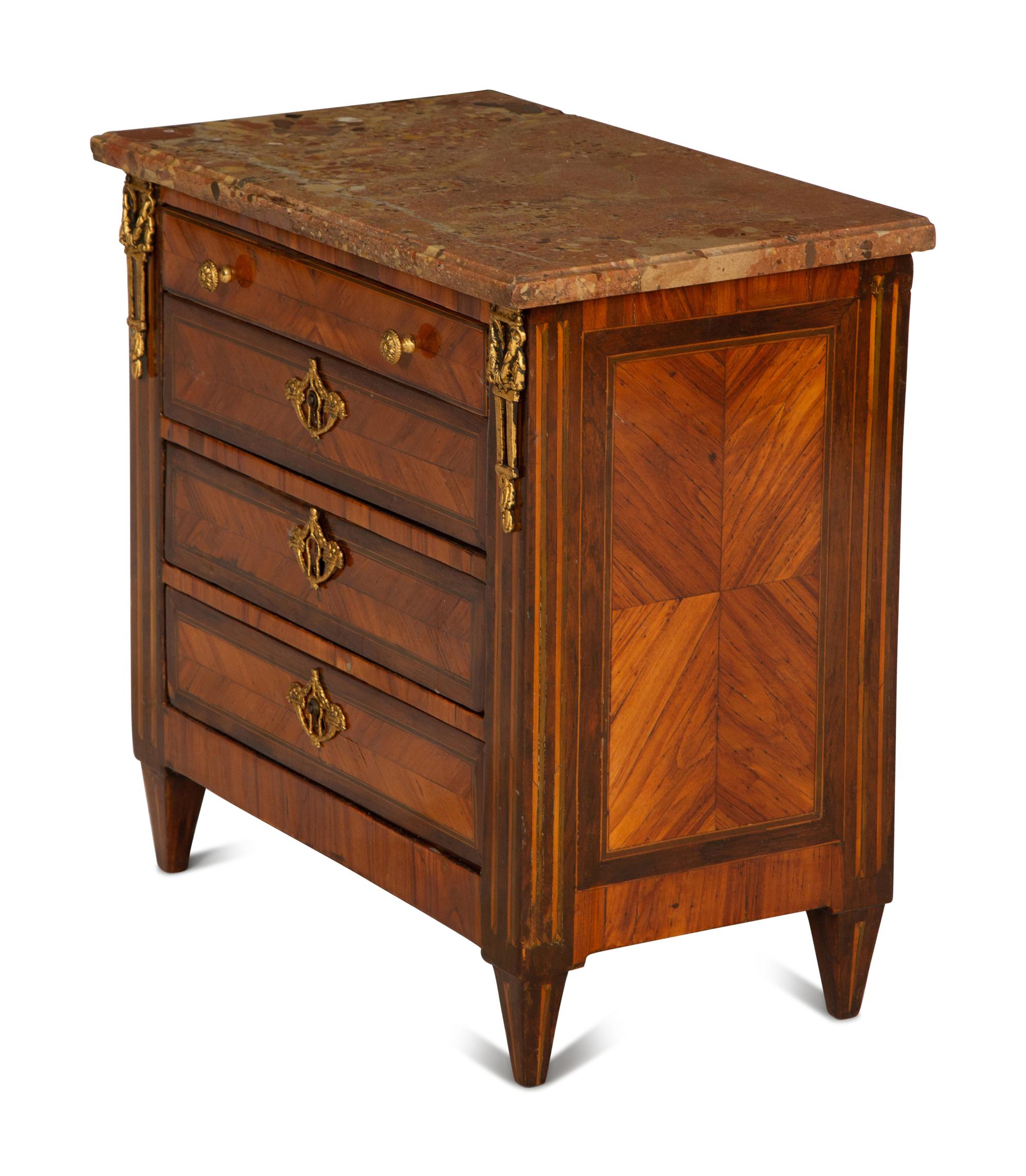 A Louis XVI Diminutive Marble-Top Four Drawer Chiffonier