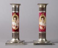 A Pair of Pairpoint Ceramic and Silvered Metal Candlesticks, Height 8 1/4 inches.