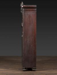An Aesthetic Movement Crane and Mask Carved Mahogany and Glass Paneled Bookcase